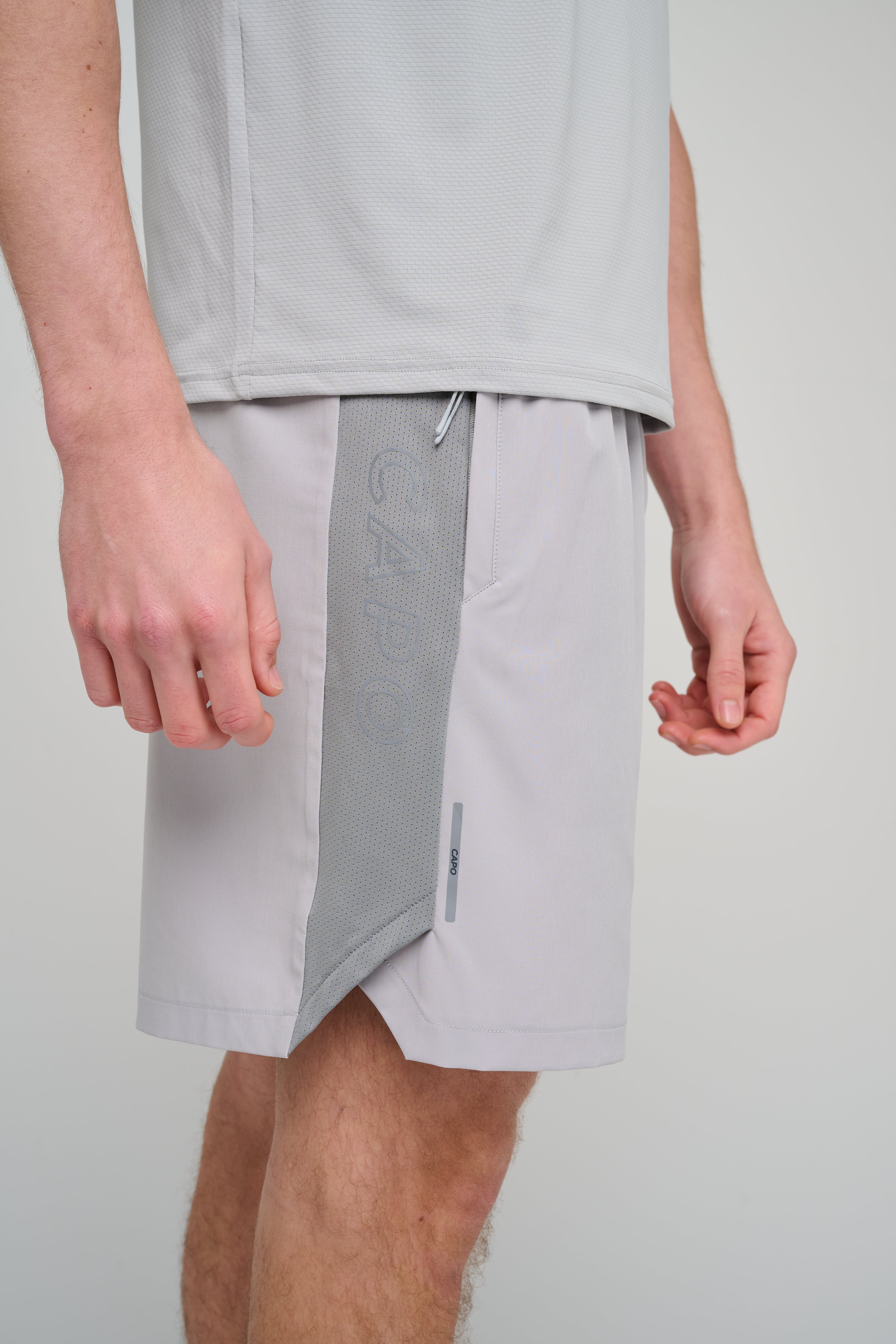 Side view of CAPO Active Performance Light Grey Shorts