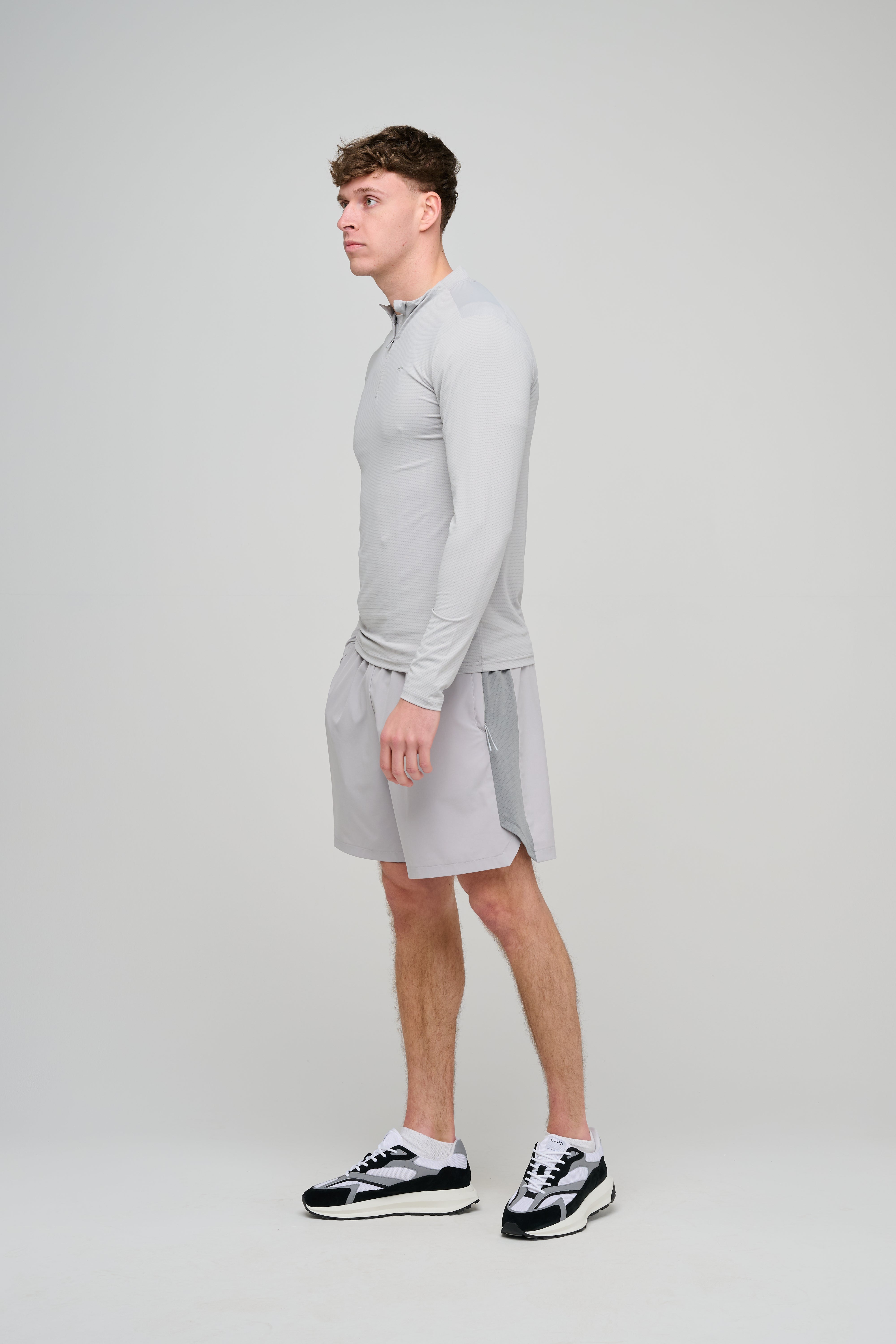 Side view of CAPO Active Performance Light Grey Shorts