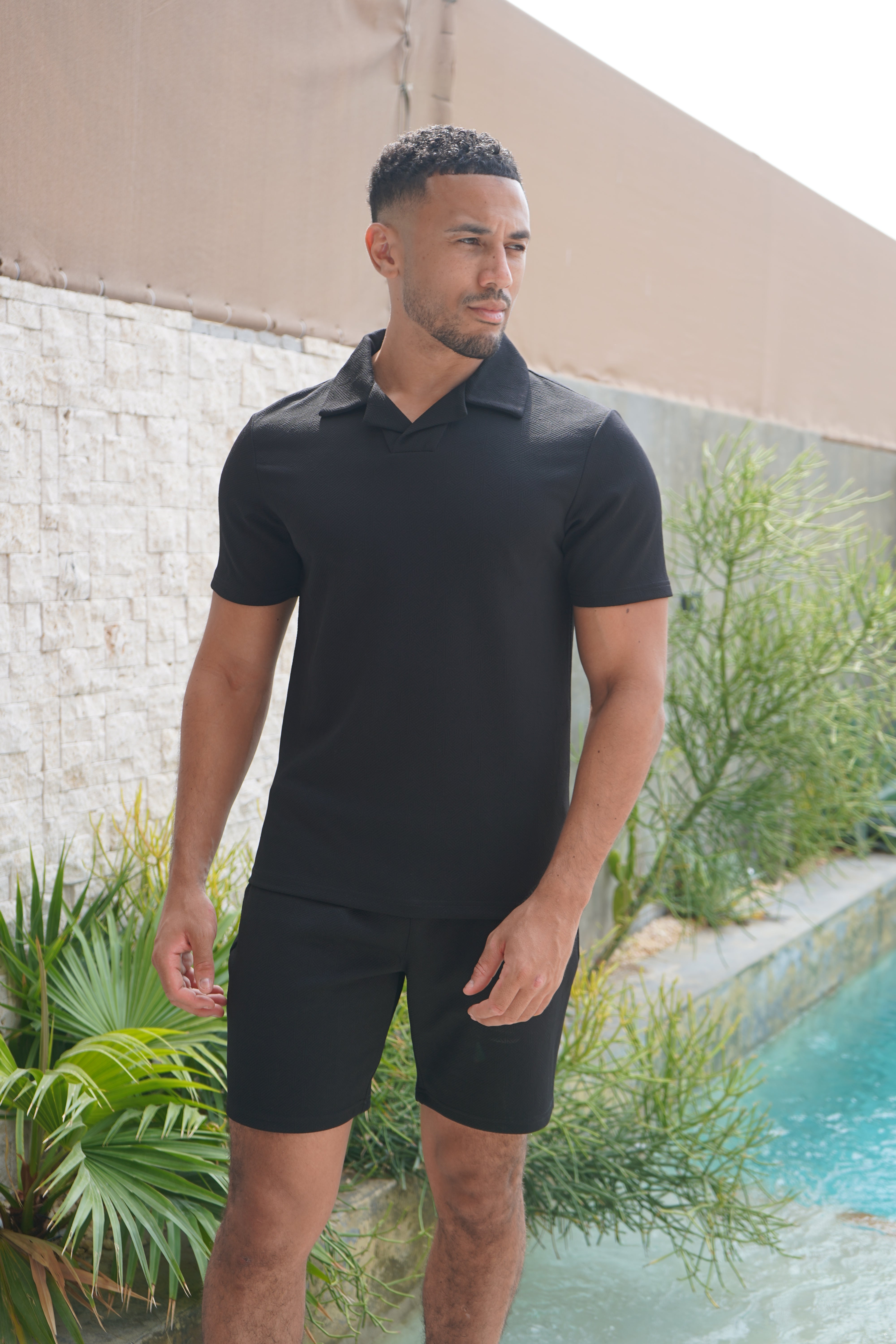 Model view of CAPO Aztec Revere Black Shorts