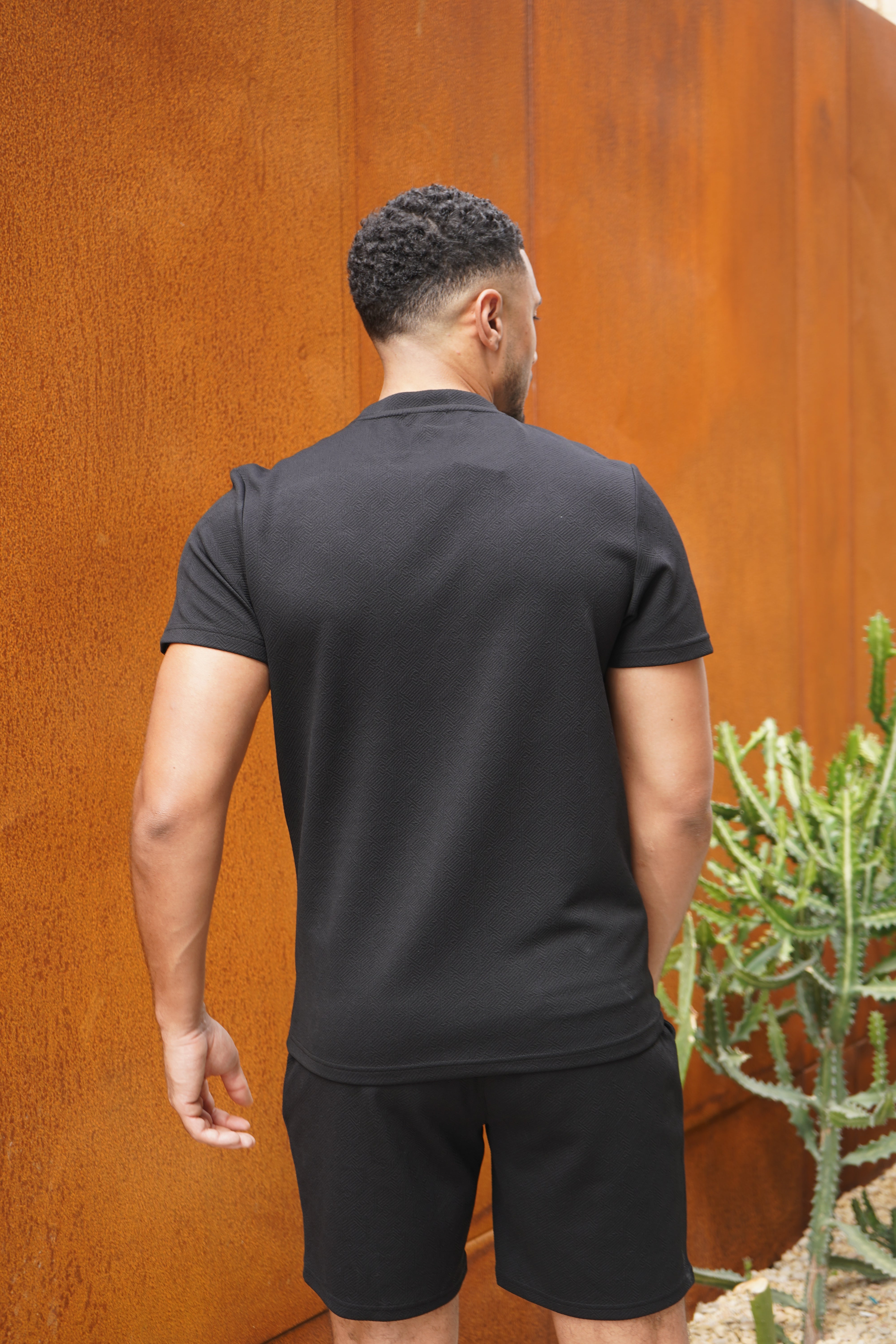 Back view of CAPO Aztec Revere Black Shorts