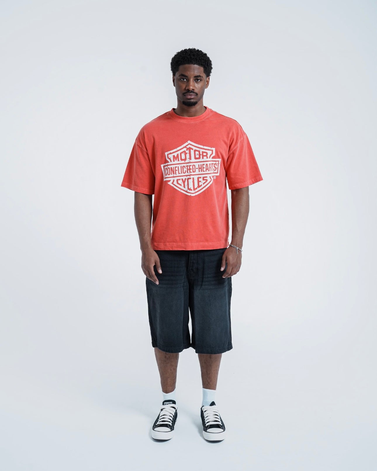 Model view of Conflicted Hearts Retro Graphic Coral Pink T-Shirt