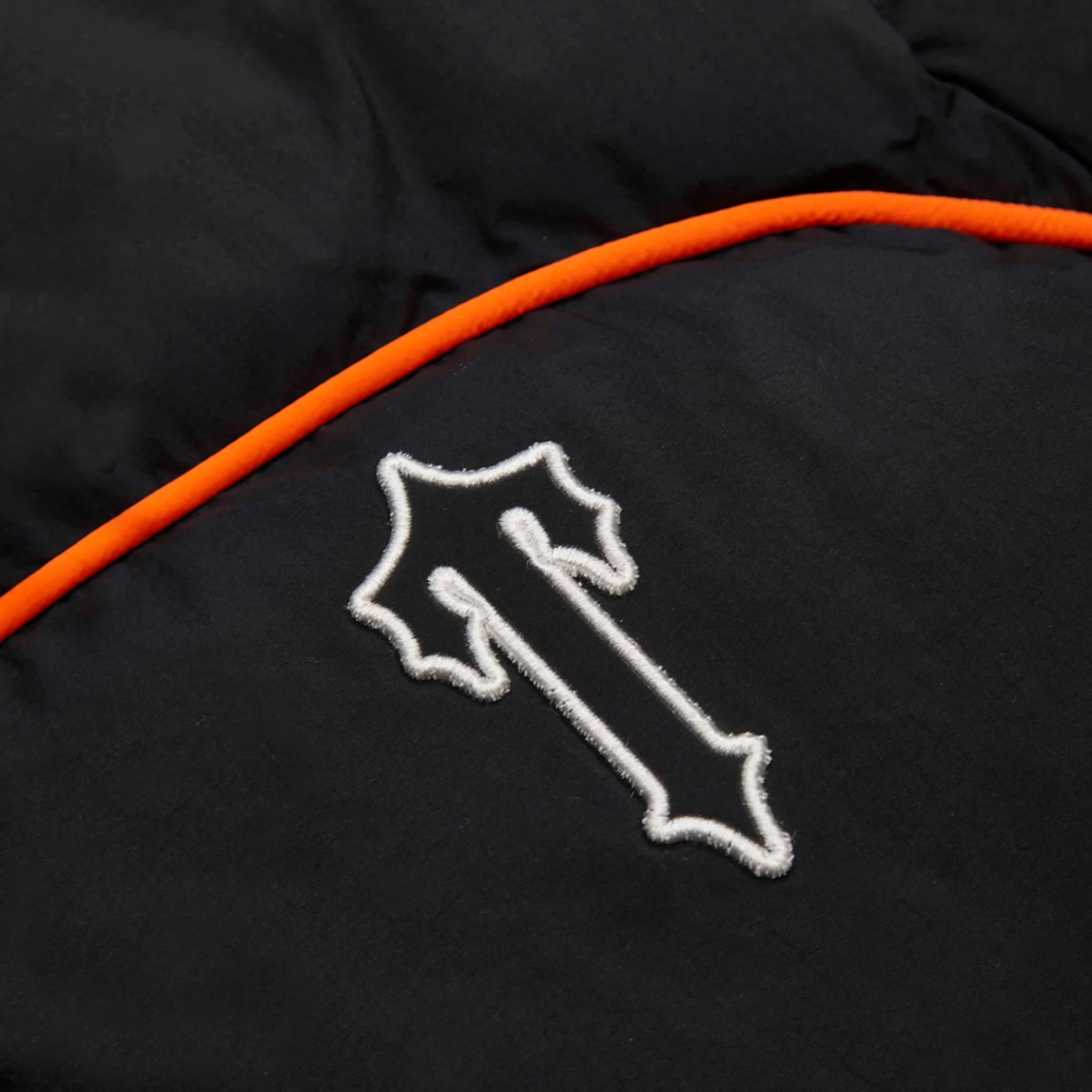 Front logo view of Trapstar Irongate Arch Piping Black Puffer