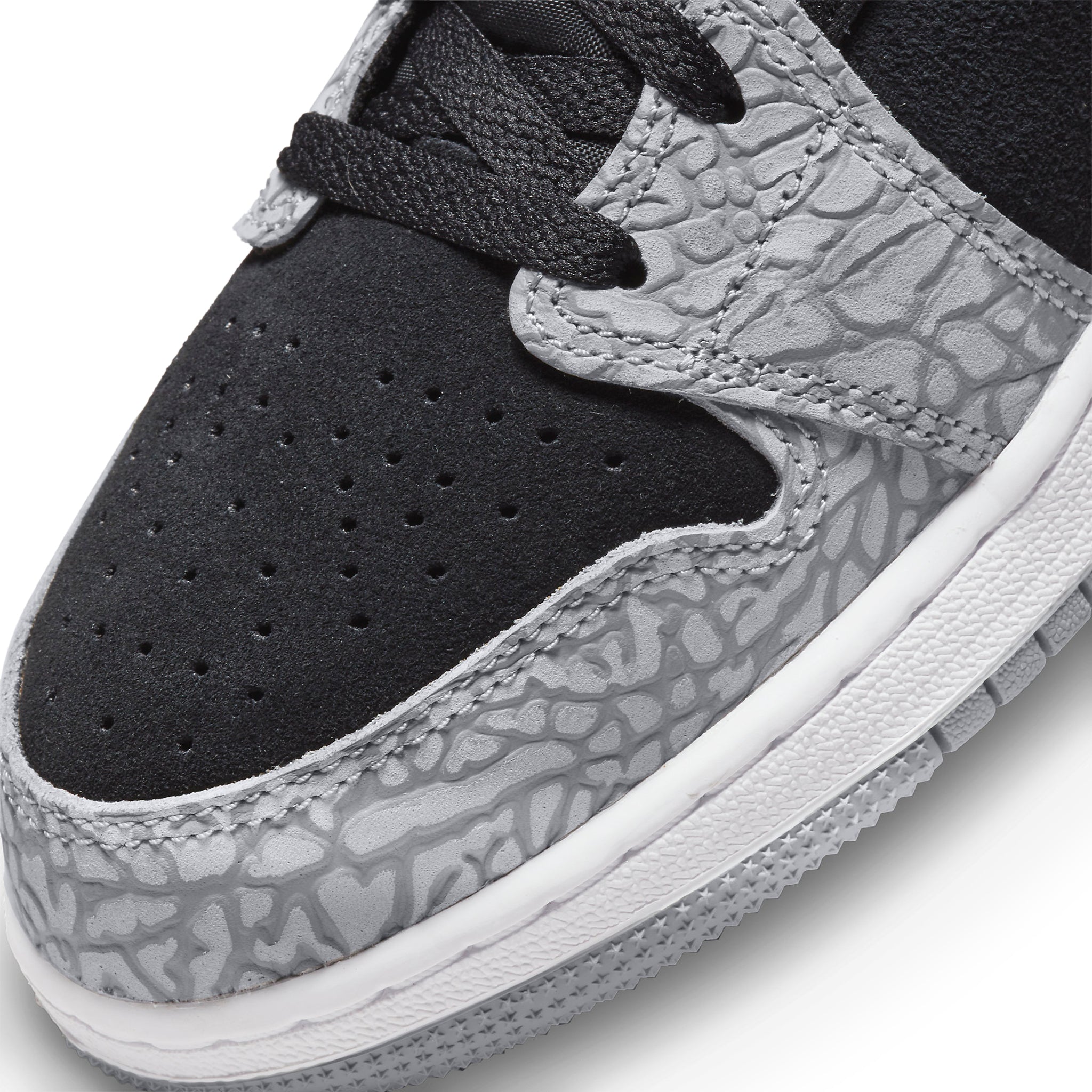 Toe box view of Air Jordan 1 Mid SE Elephant Print (GS) DM6216-016
