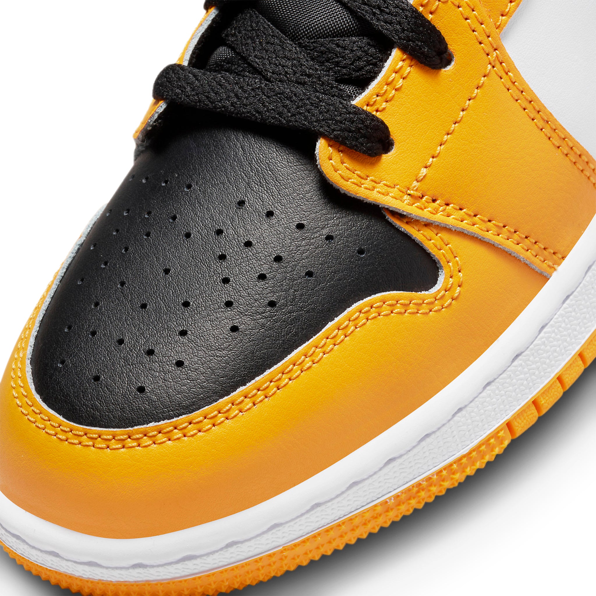 Toe box view of Air Jordan 1 Mid Taxi (GS) 554725-701