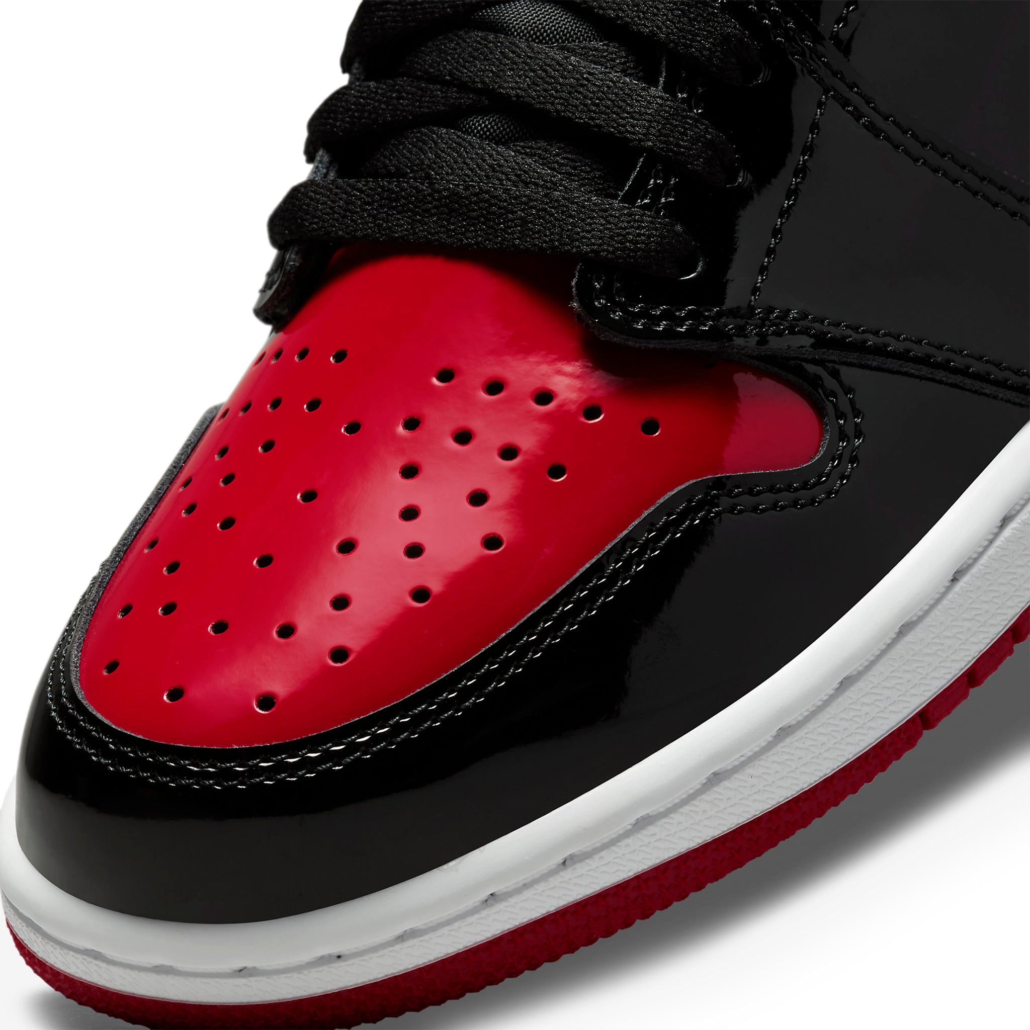 Toe box side view of Air Jordan 1 Retro High OG Patent Bred 555088-063