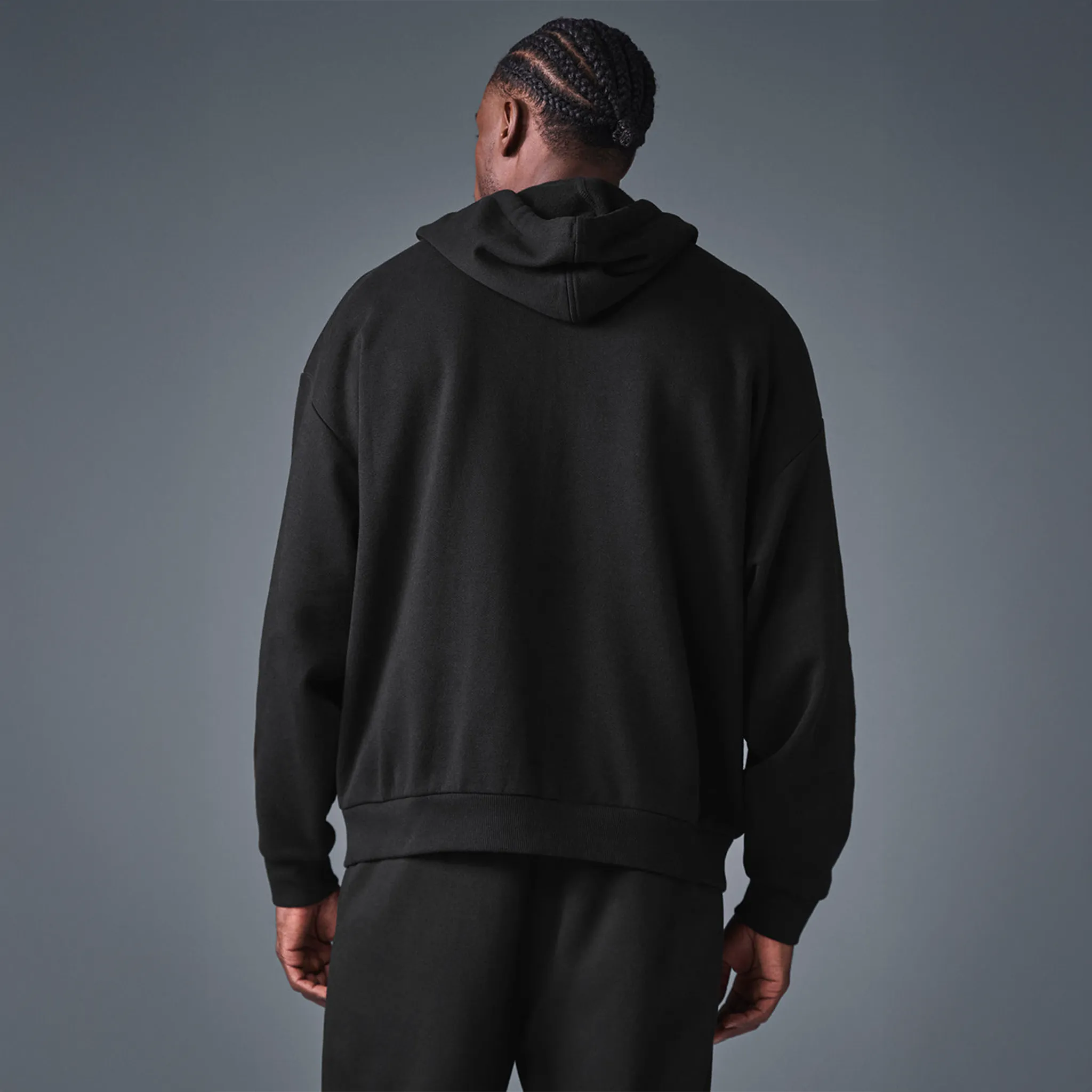 Back View of Alo Yoga Accolade Black Zip-Up Hoodie