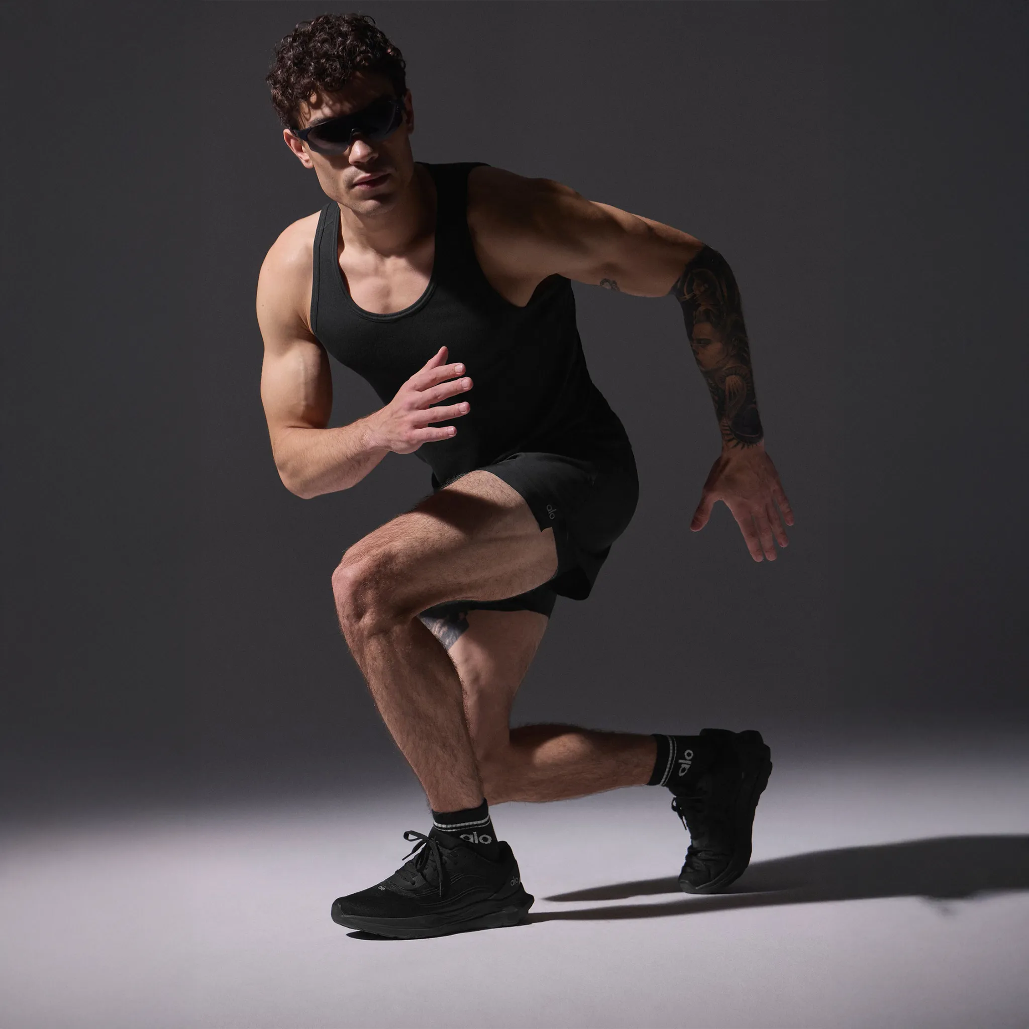 Model View of Alo Yoga Black Runner