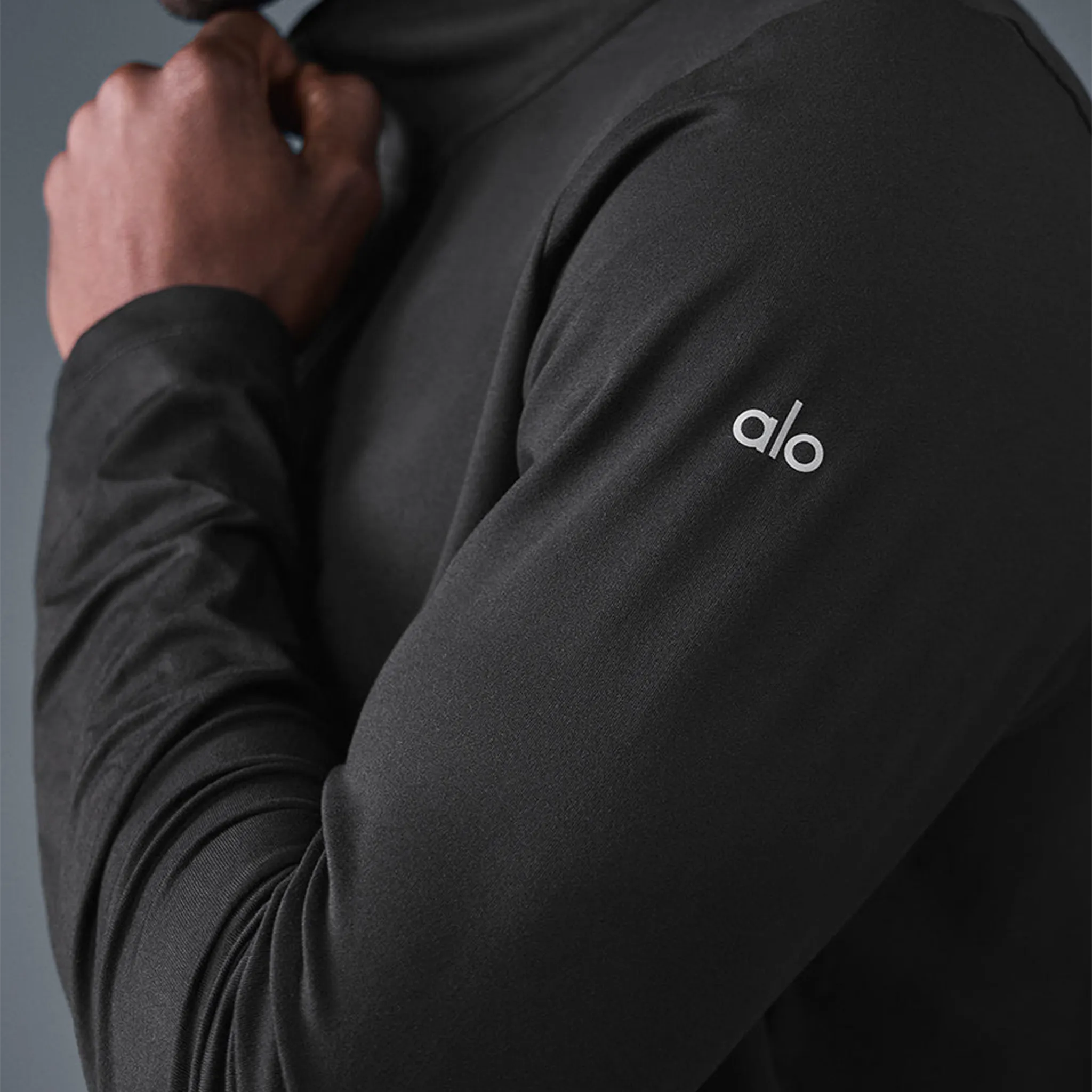 Detailed Side View of Alo Yoga Conquer Reform L/S 1/4 Zip