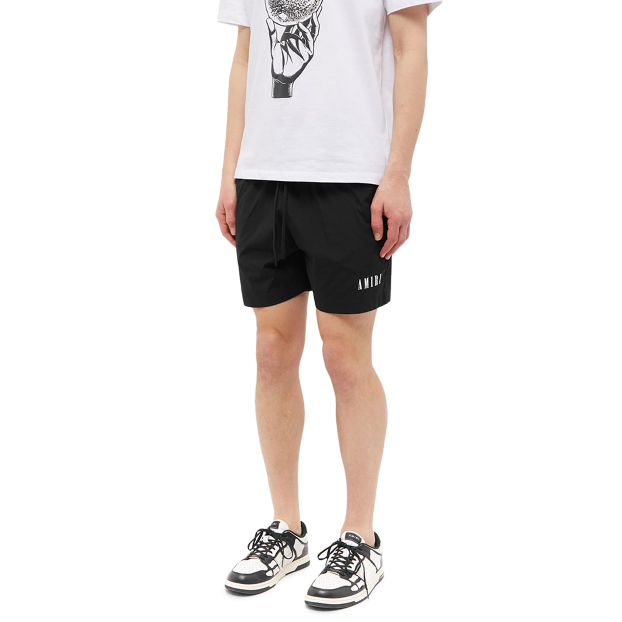 model front side of Amiri Core Logo Swim Shorts Black PXMSB001-001