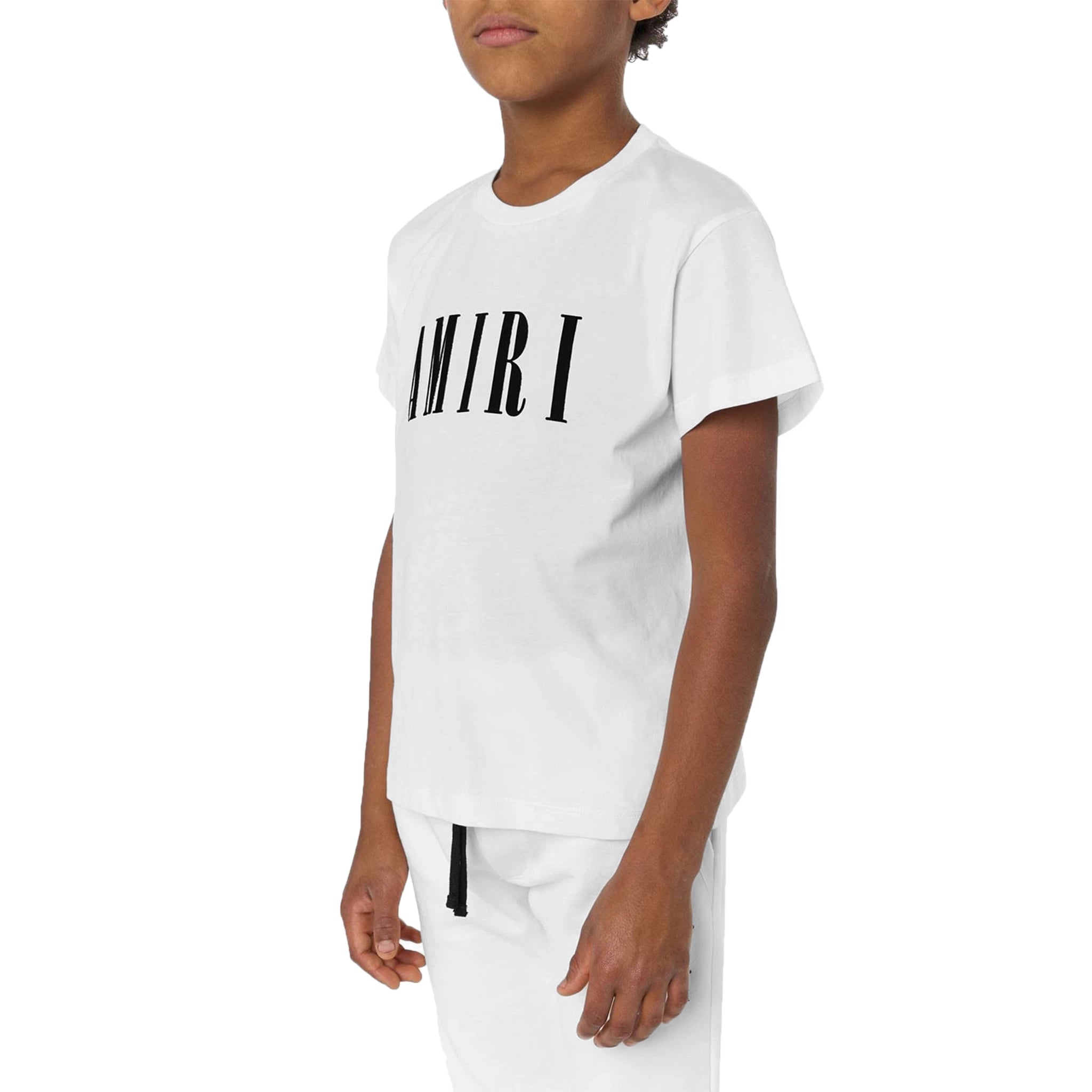 Model side view of Amiri Kids 'Amiri' White T Shirt PF22KJL013-100
