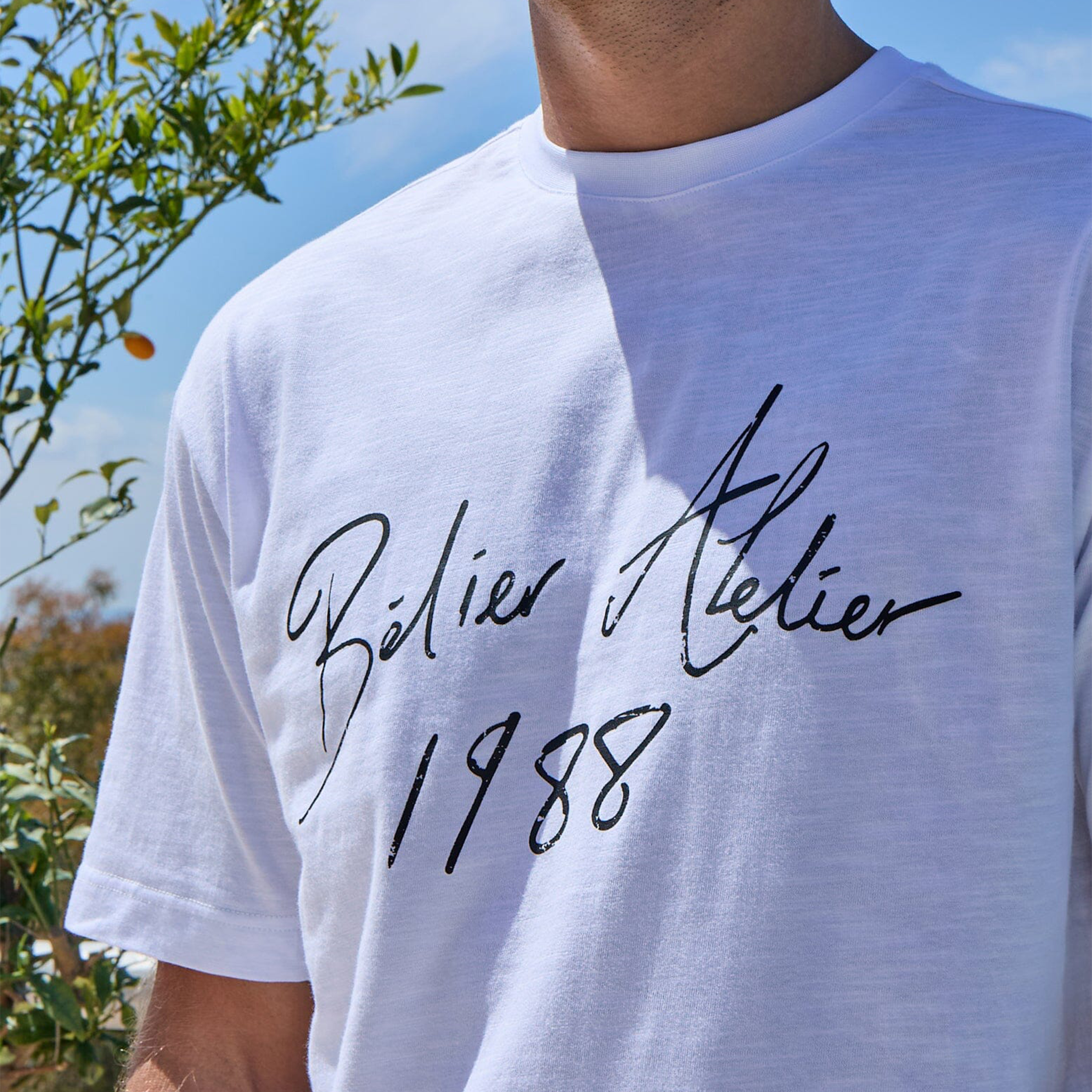 Detailed Front View of Belier Slub Texture Atelier Signature White T Shirt