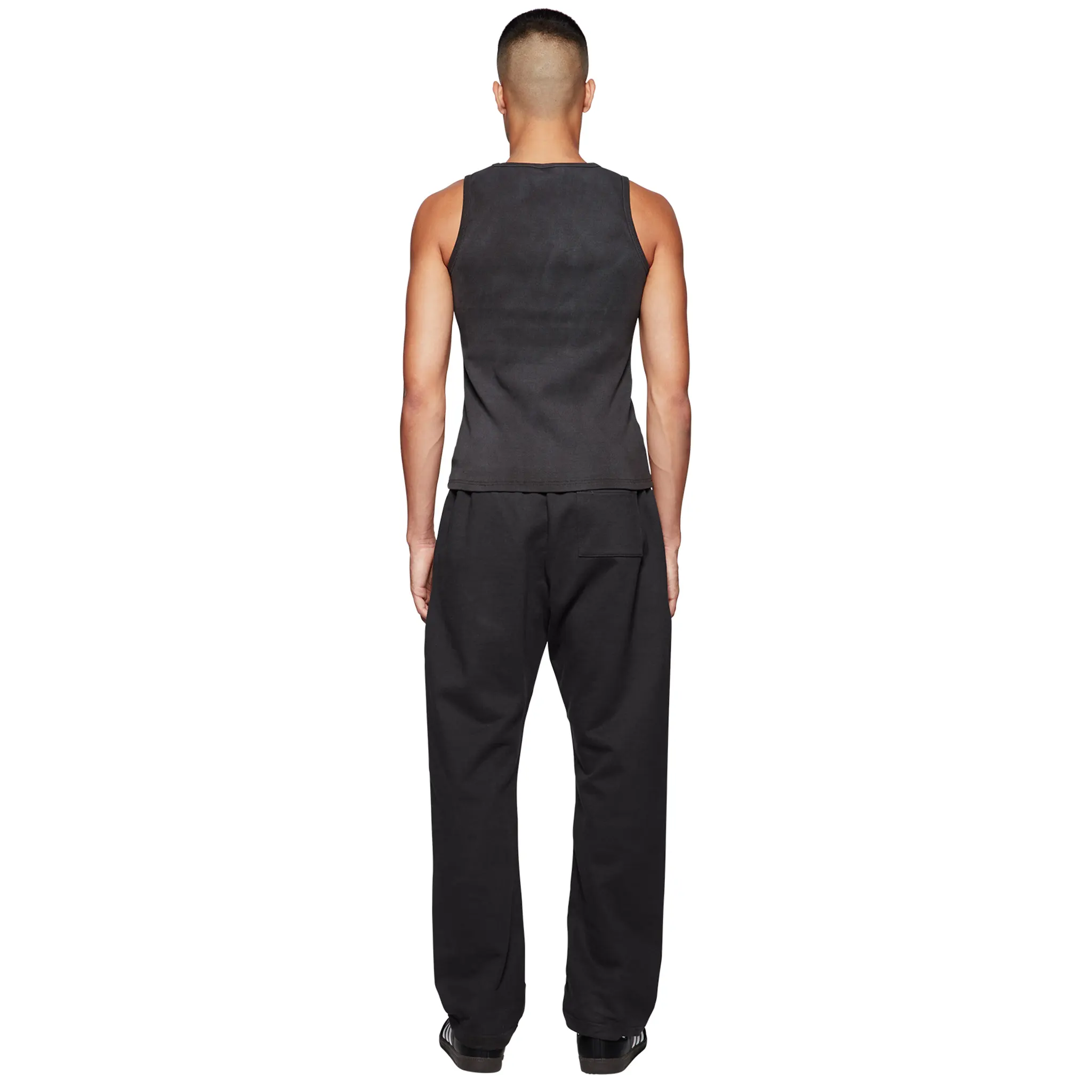 Model back view of Broken Planet Basics Straight Leg Washed Midnight Black Sweatpants