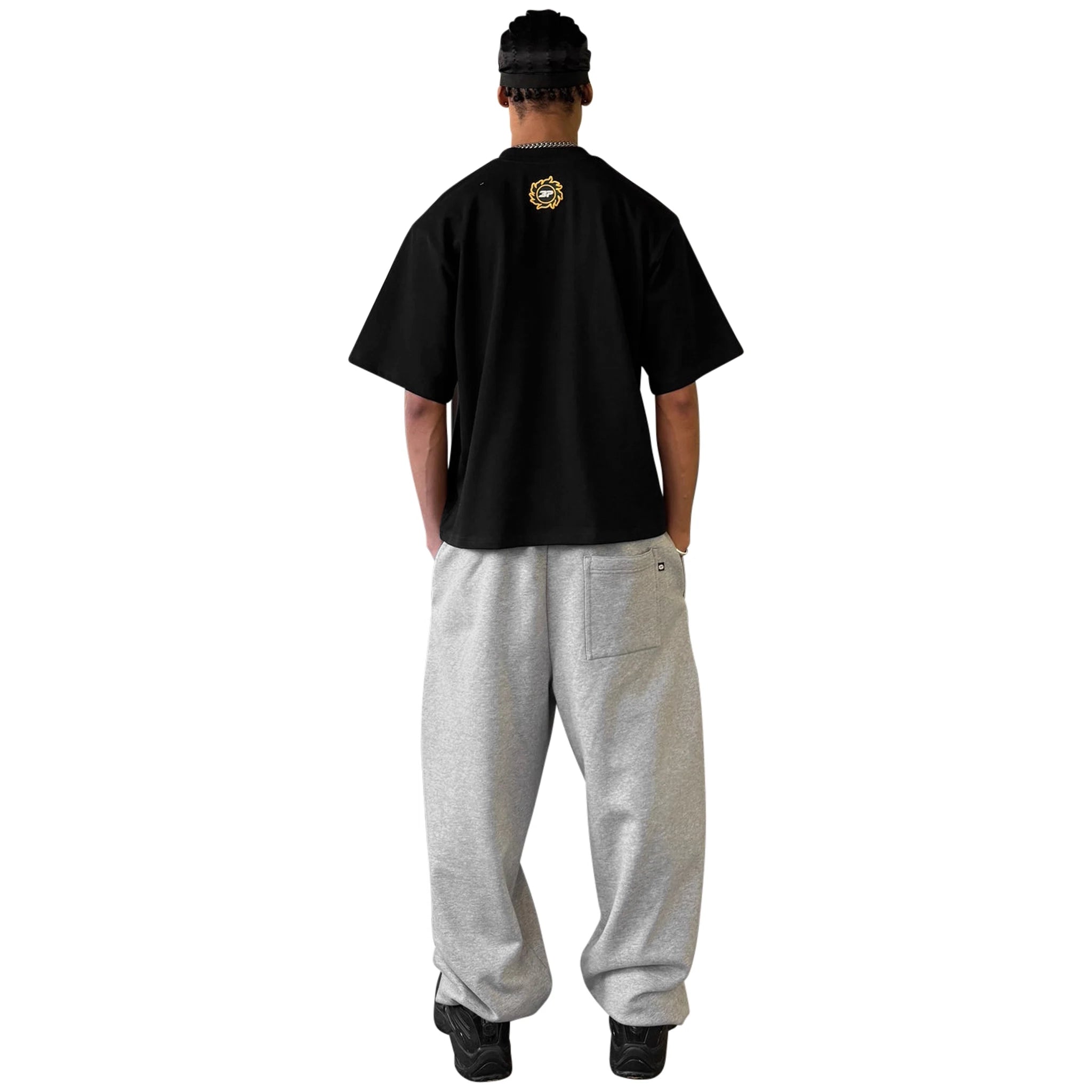 Model back view of Broken Planet Crest Midnight Black T Shirt BP-J25-TS-M_BLACK