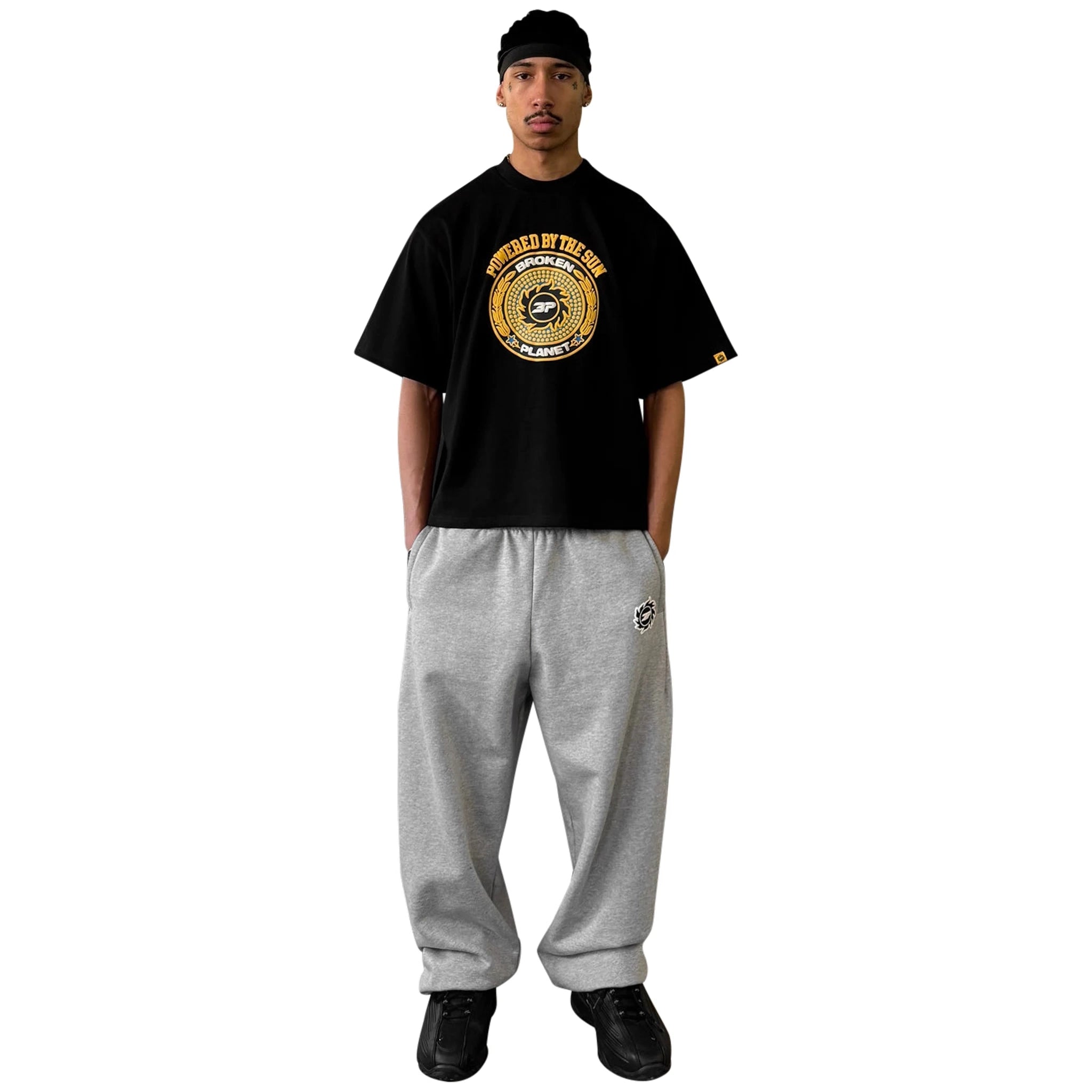 Model front view of Broken Planet Crest Midnight Black T Shirt BP-J25-TS-M_BLACK