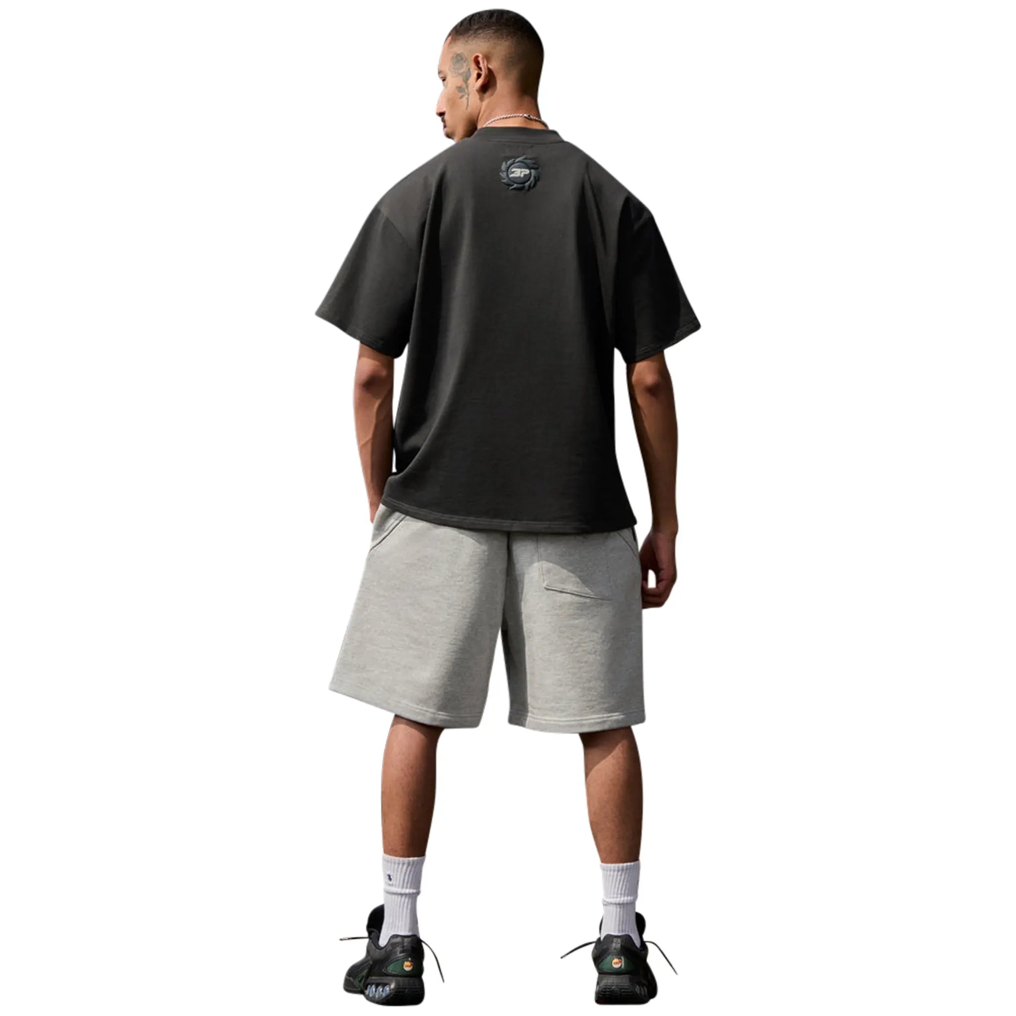 Model Back view of Broken Planet Falling Stars Soot Black T Shirt