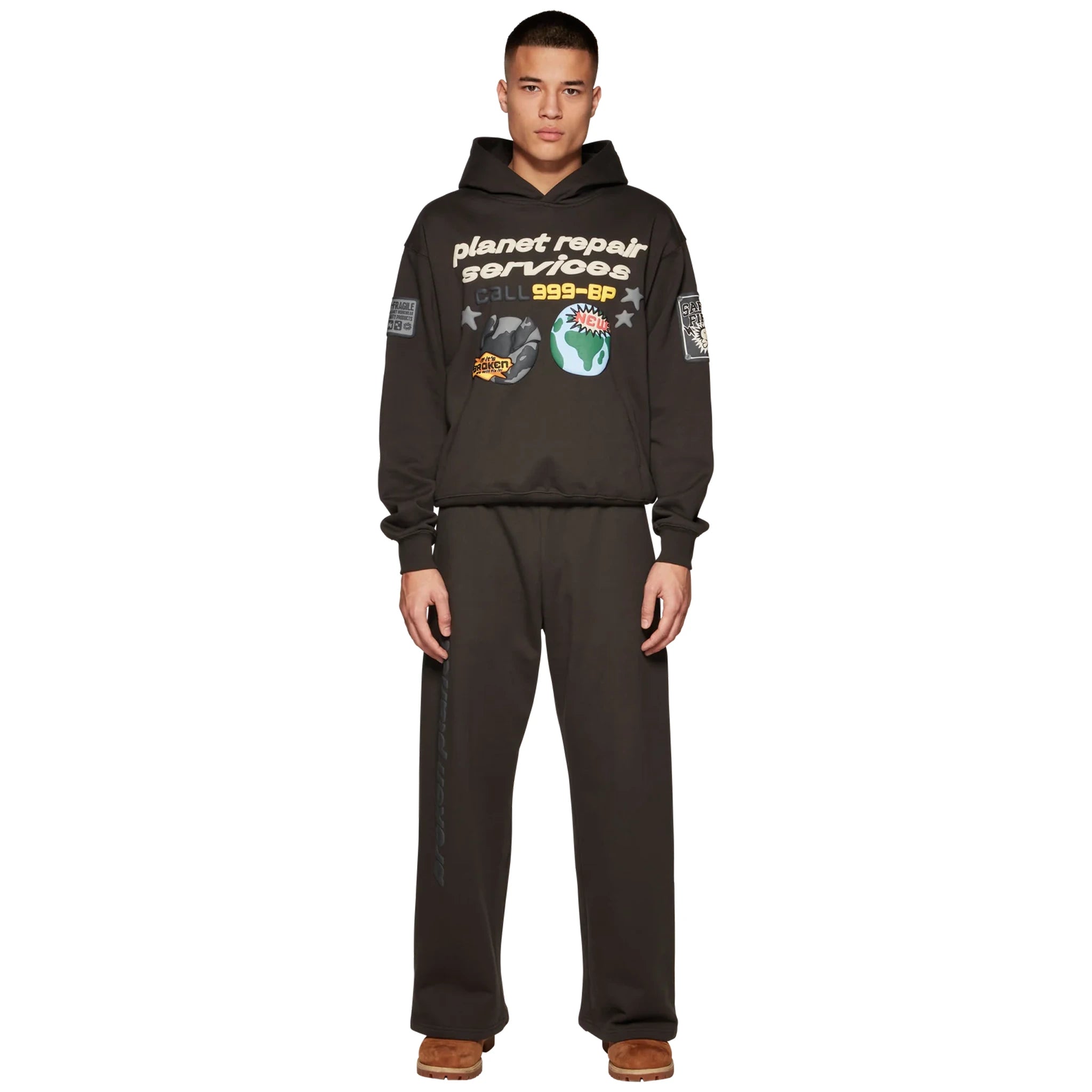 Model front view of Broken Planet Repair Services Soot Black Hoodie