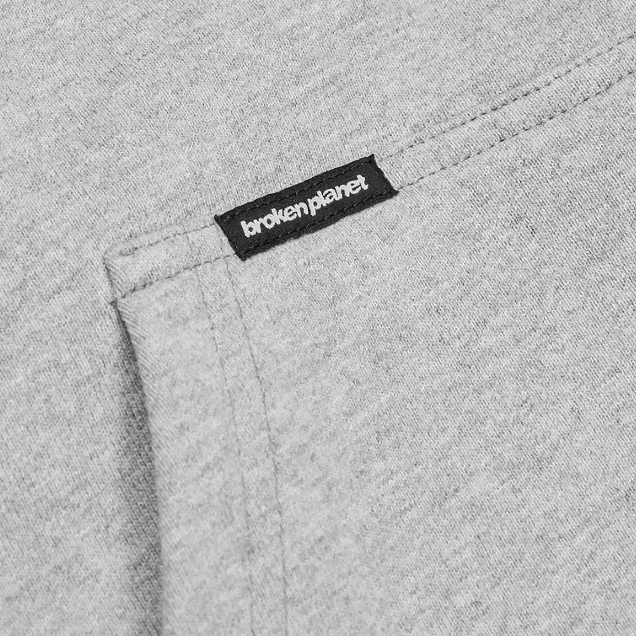 Pocket view of Broken Planet Sun Heather Grey Zip-Up Hoodie