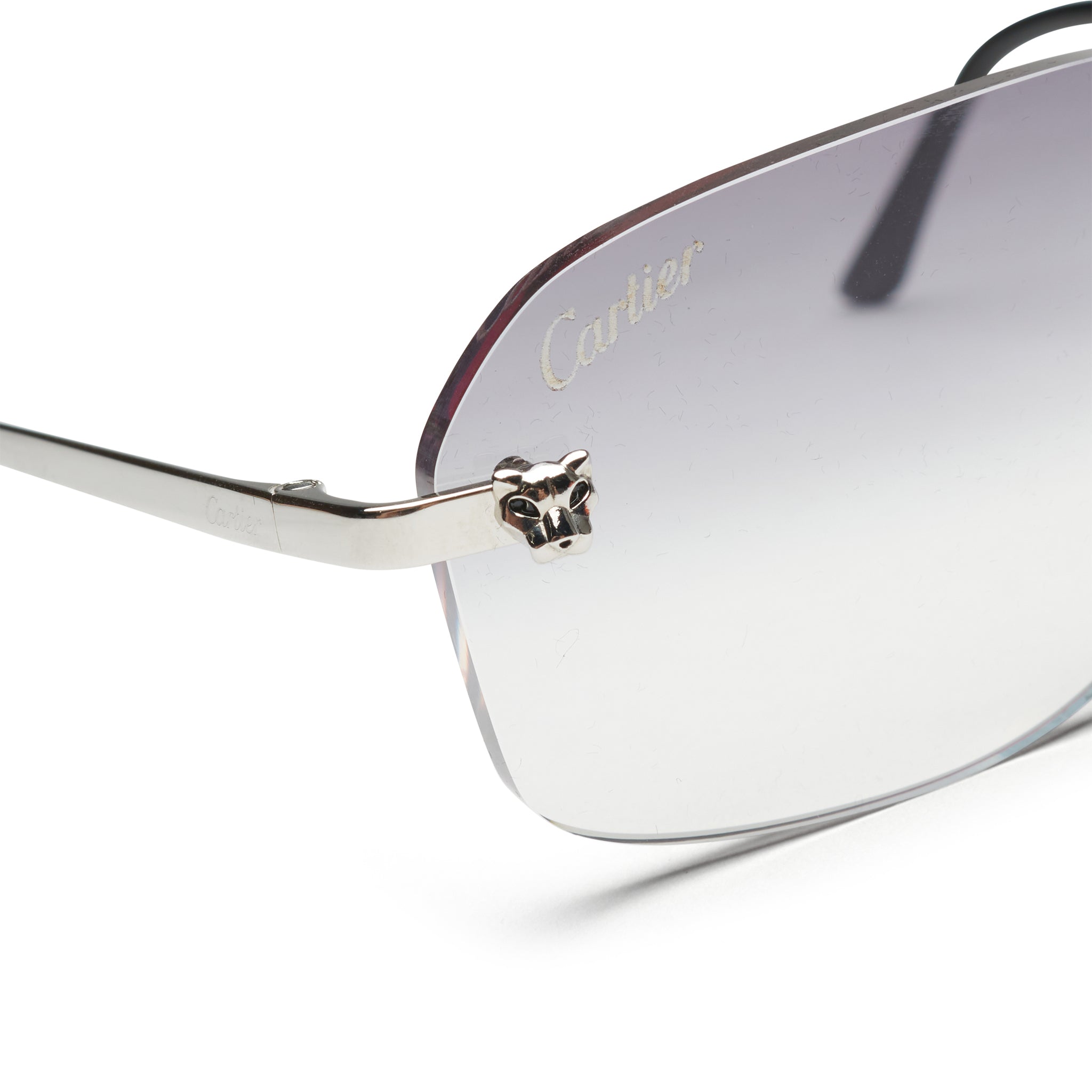Corner view of Cartier Eyewear Custom CT0148O-002 Panthere De Cartier Rimless Sunglasses