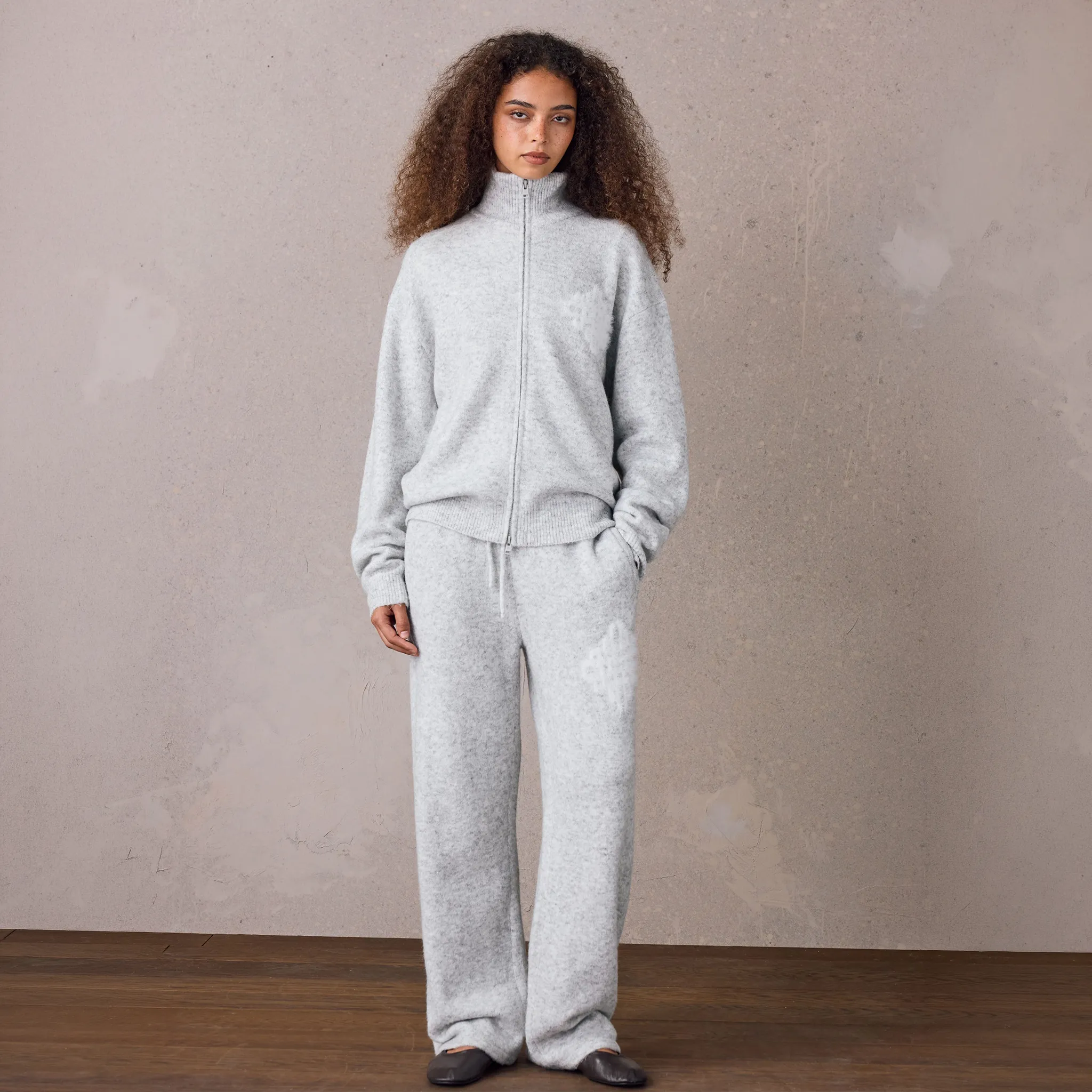 Model Front View of The Couture Club Emblem Fluff Knit Grey Marl Sweatpants TCCM3373