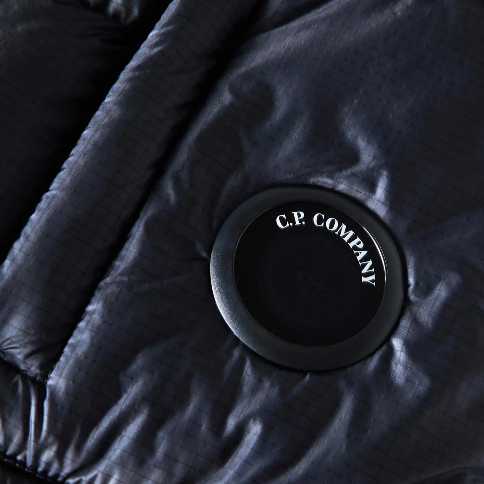 Detail view of CP Company D.D. Shell Total Eclipse Blue Hooded Puffer Jacket