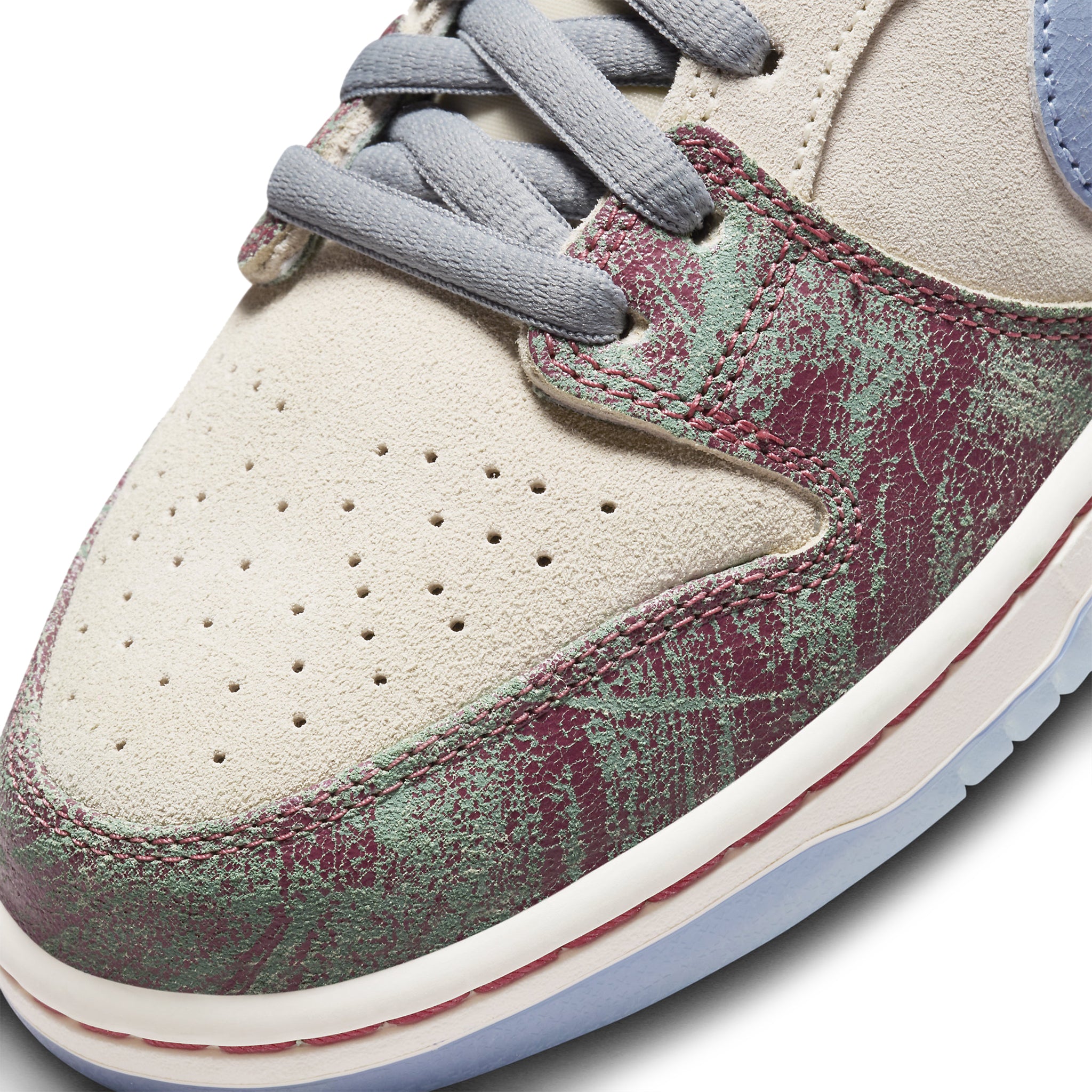 Toe box view of Crenshaw Skate Club x Nike SB Dunk Low FN4193-100