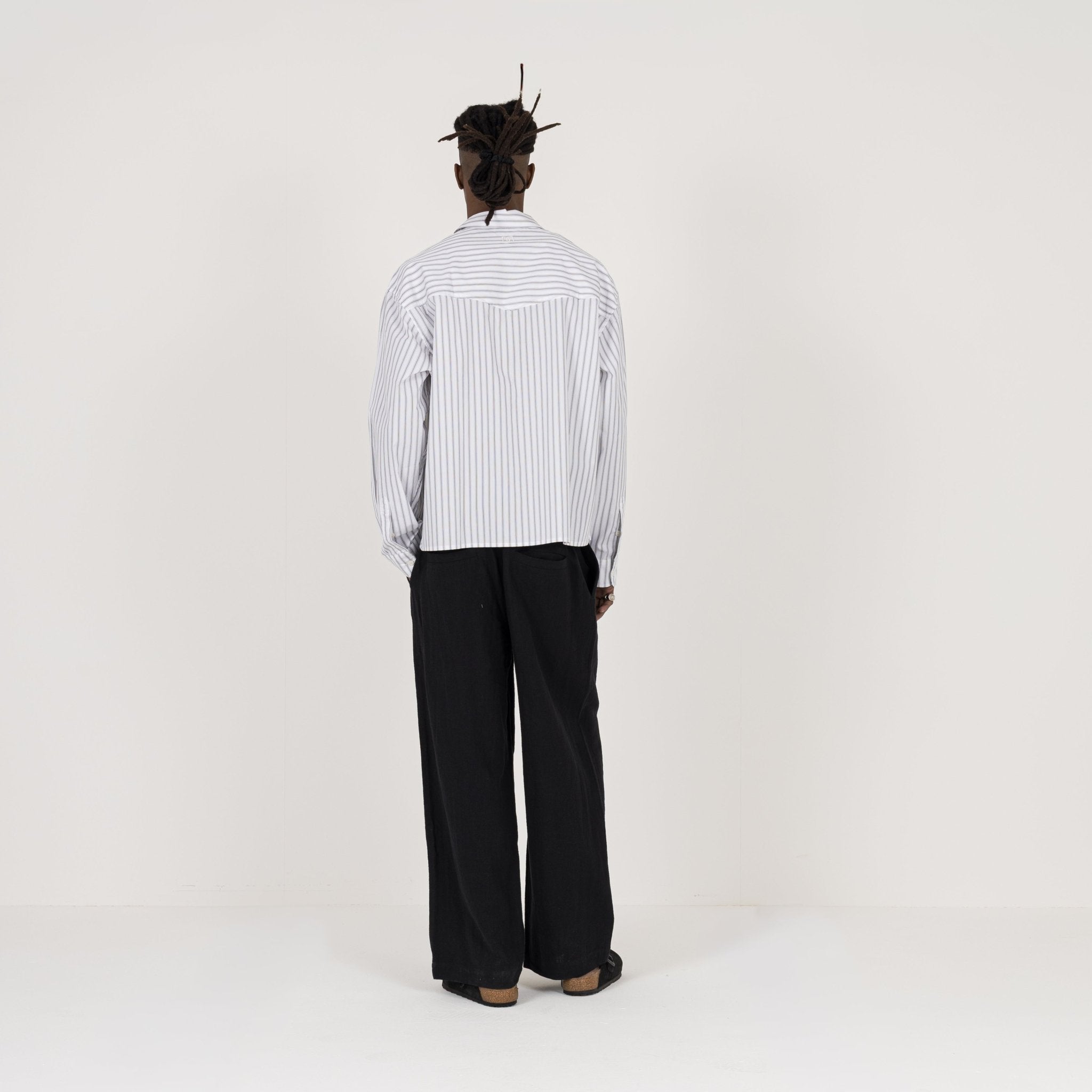 Model Back view of Destructive Cropped L/S White Pinstripe Shirt
