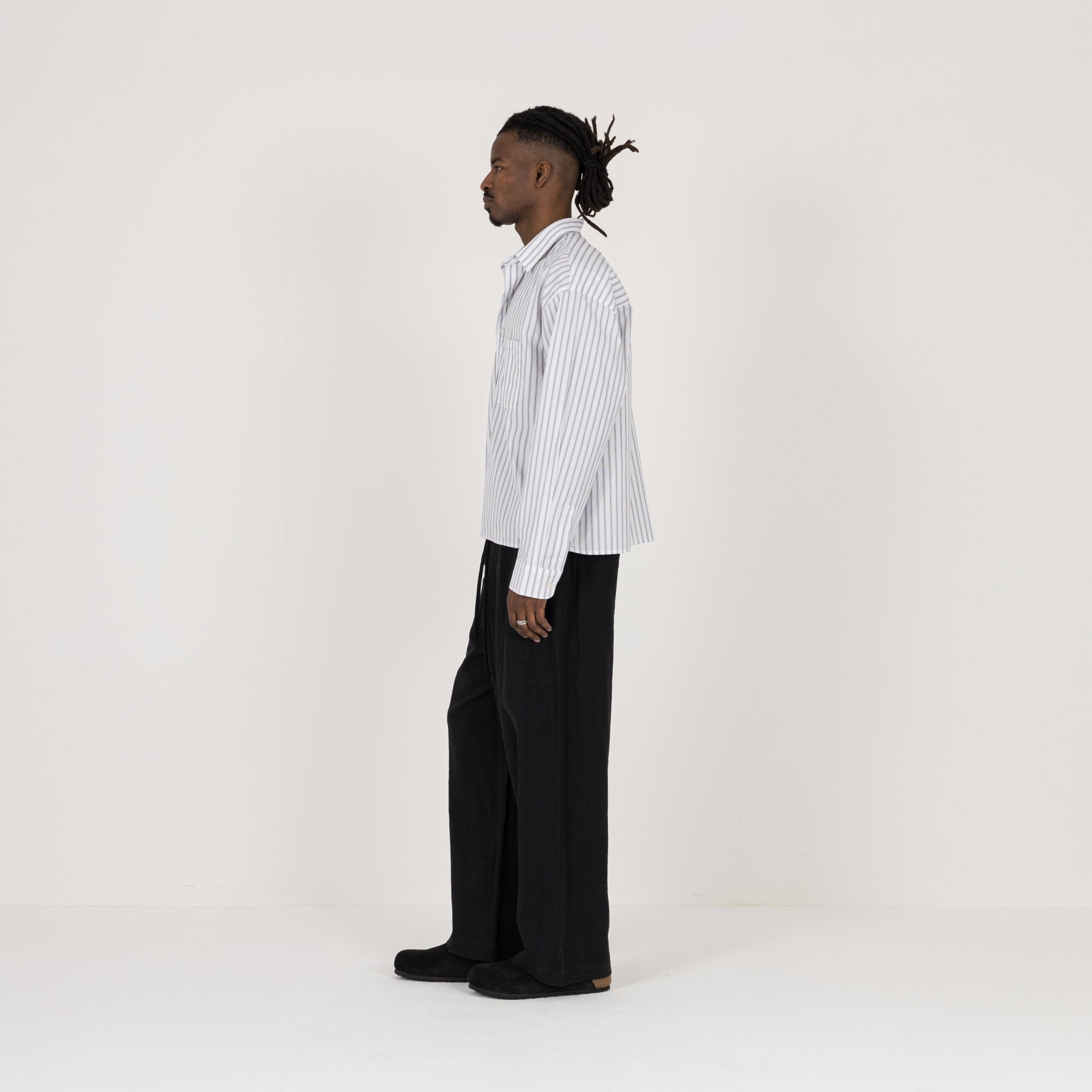 Model Side view of Destructive Cropped L/S White Pinstripe Shirt