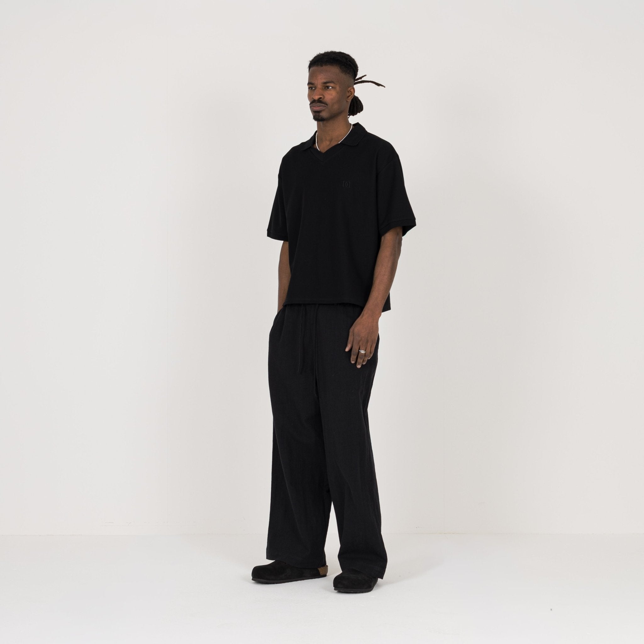 Model view of Destructive Cropped Black Polo Shirt
