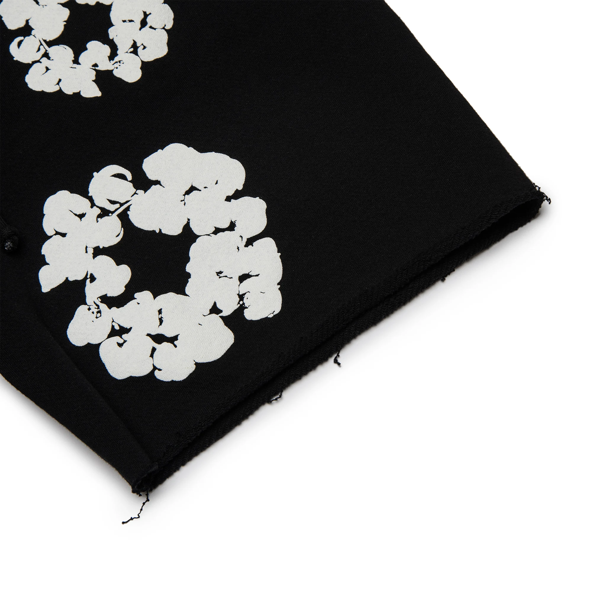 Leg view of Denim Tears The Cotton Wreath Black Shorts