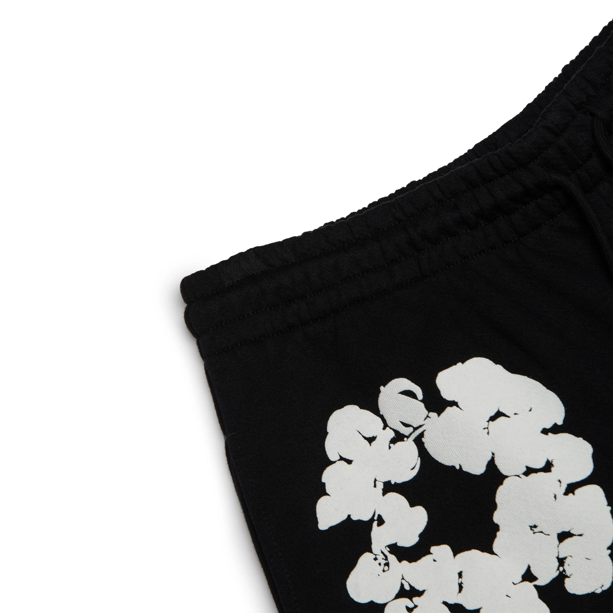 Corner view of Denim Tears The Cotton Wreath Black Sweatpants