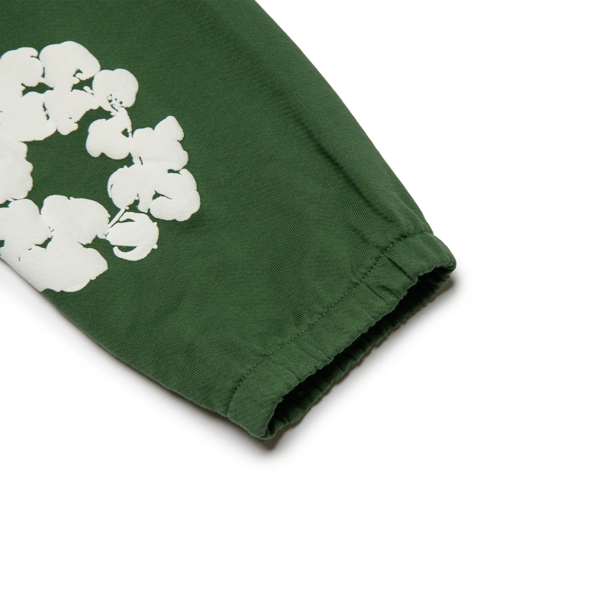 Leg view of Denim Tears The Cotton Wreath Green Sweatpants