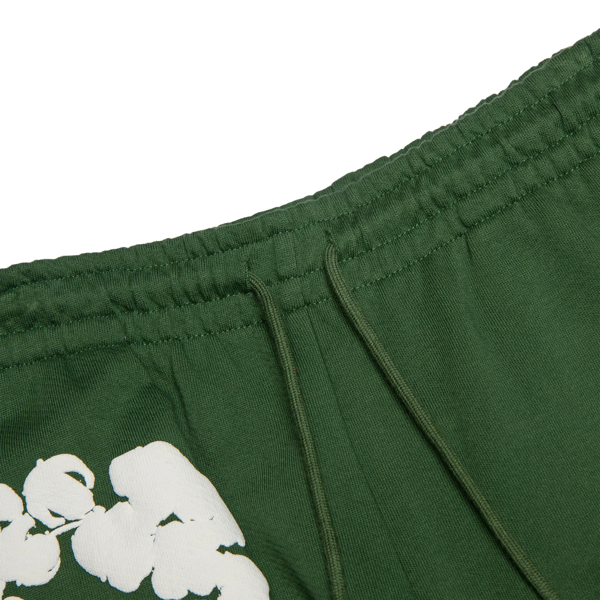 Waist view of Denim Tears The Cotton Wreath Green Sweatpants