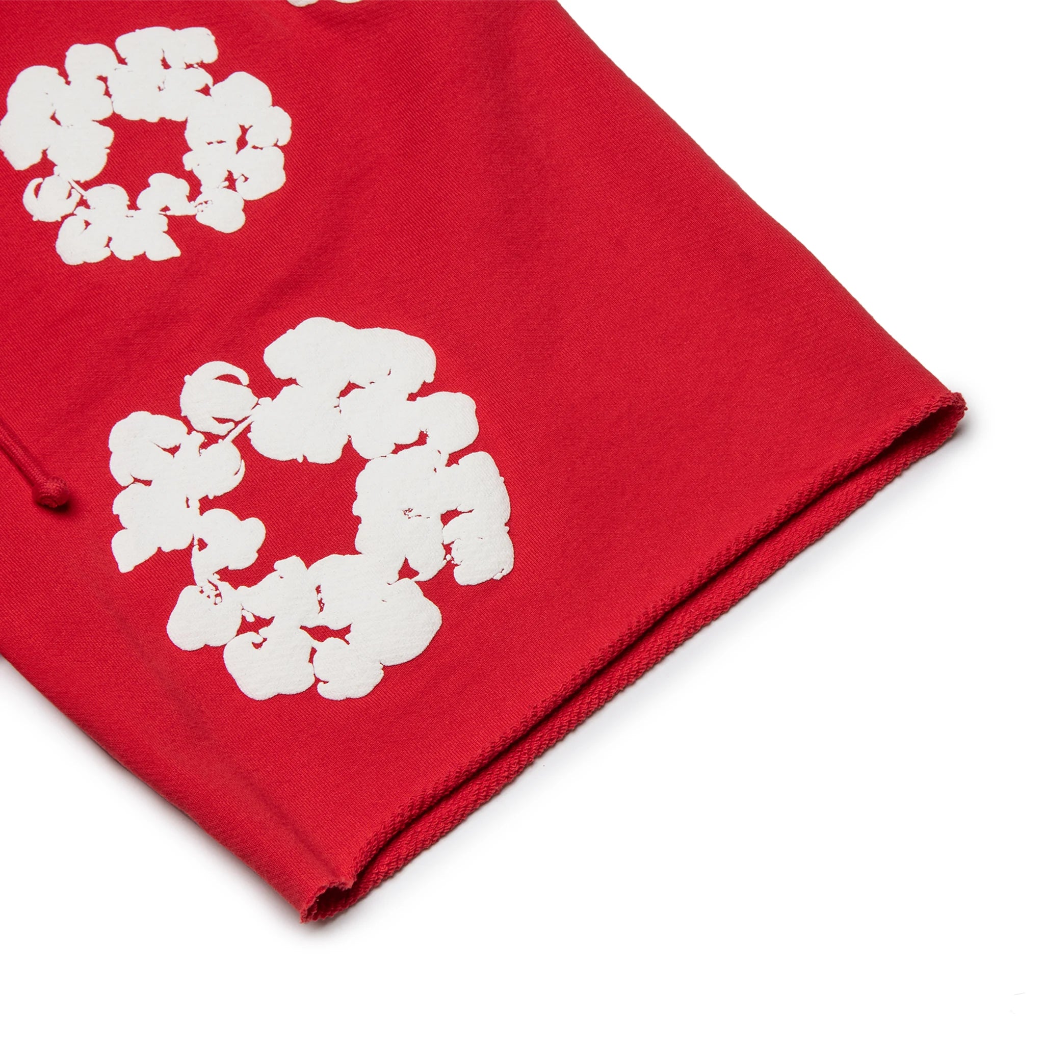 Leg view of Denim Tears The Cotton Wreath Red Shorts