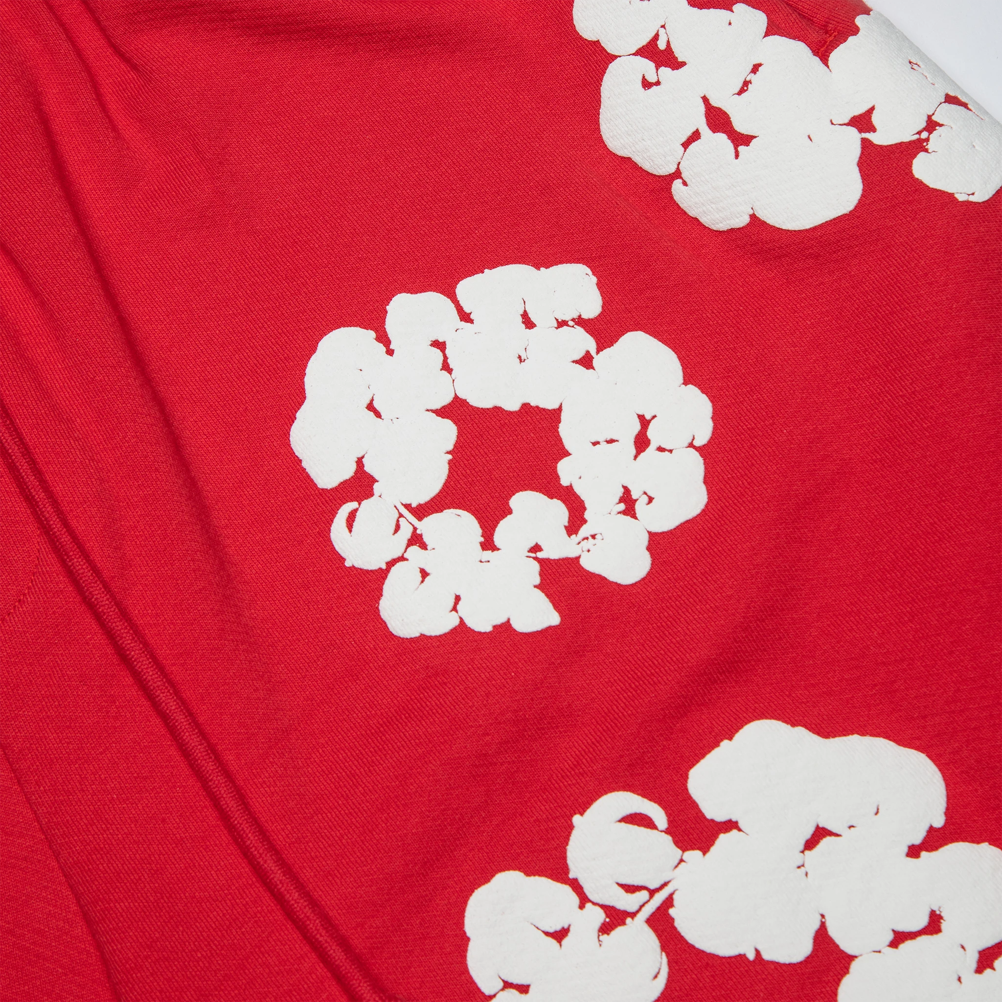 String view of Denim Tears The Cotton Wreath Red Shorts