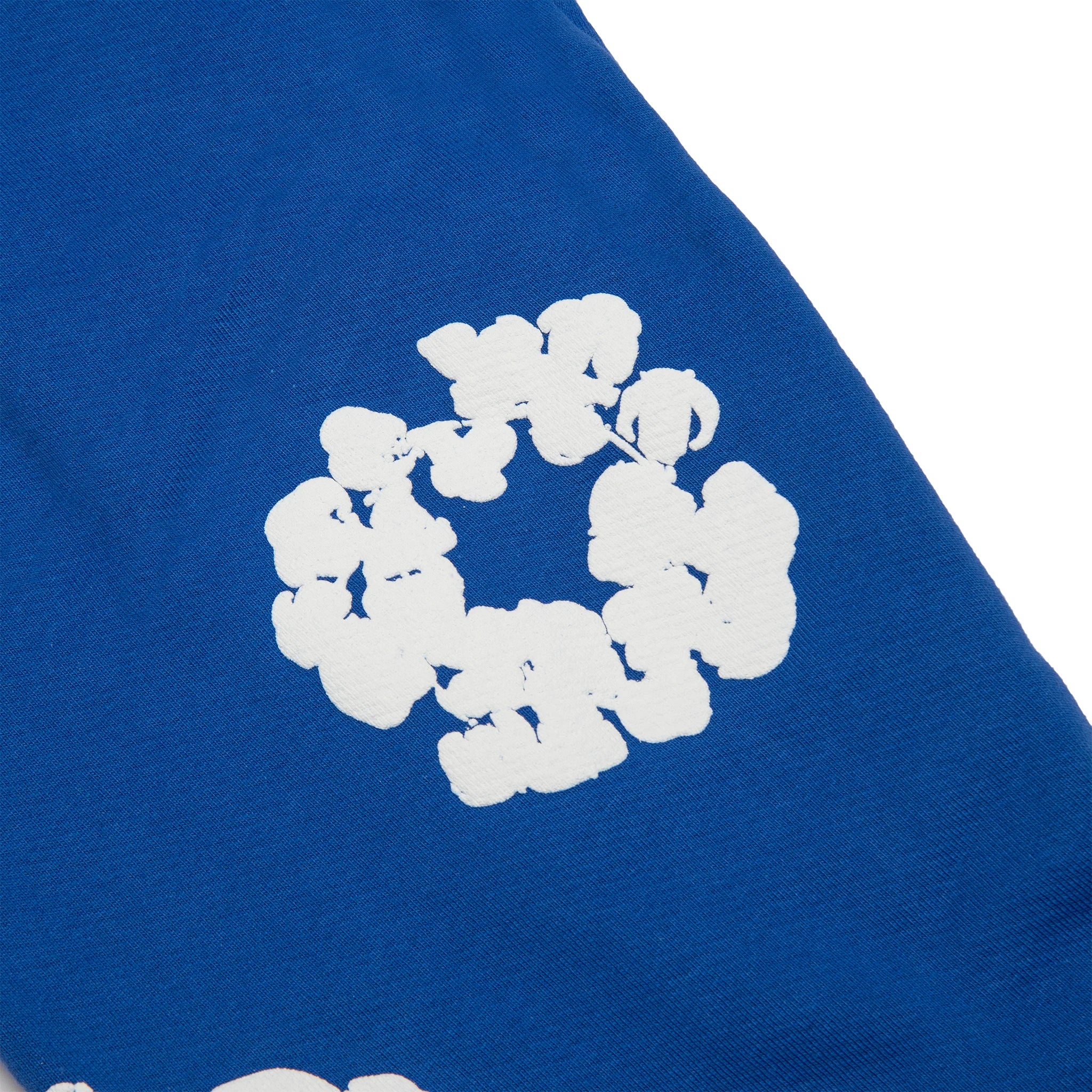 Patch view of Denim Tears The Cotton Wreath Royal Blue Sweatpants