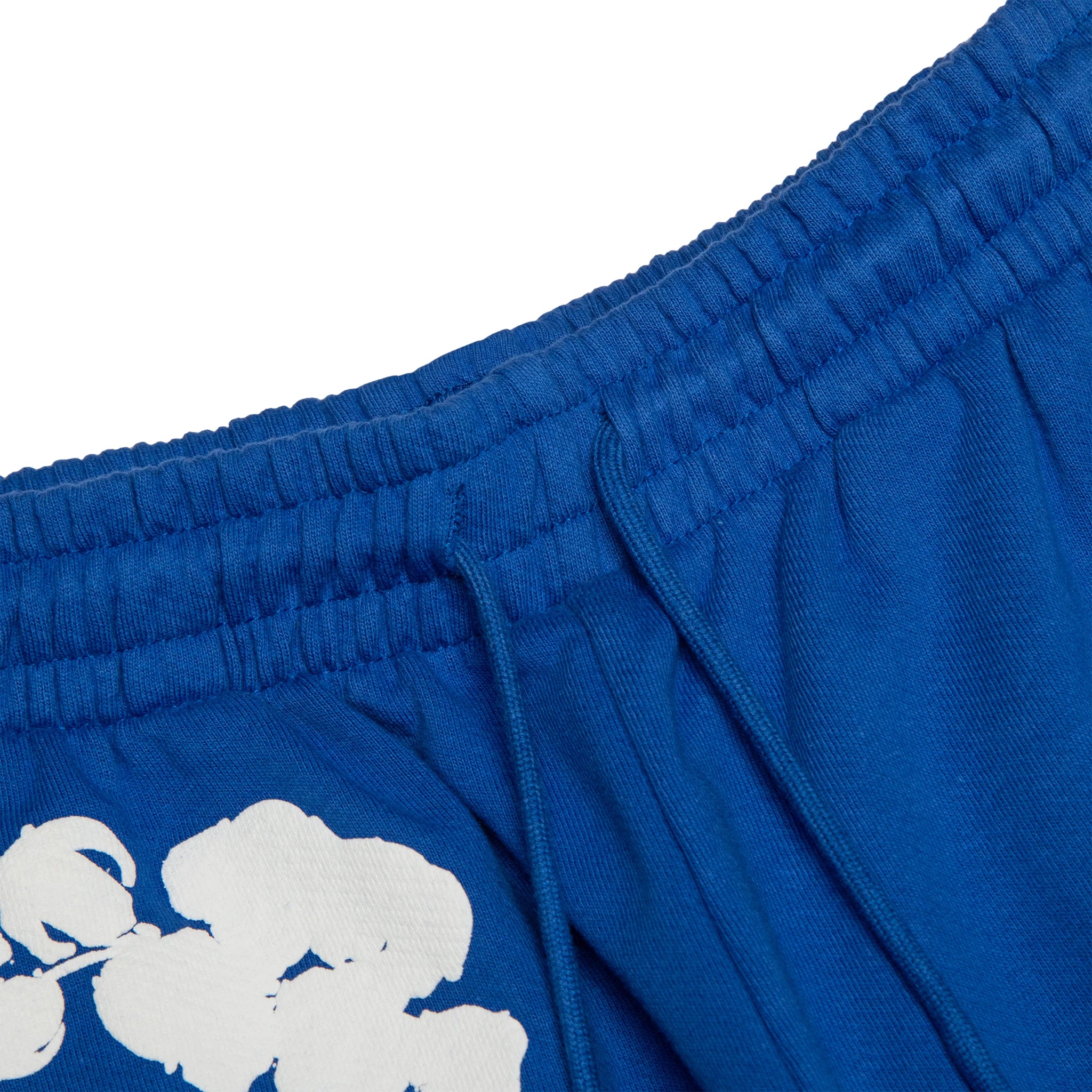 Waist view of Denim Tears The Cotton Wreath Royal Blue Sweatpants