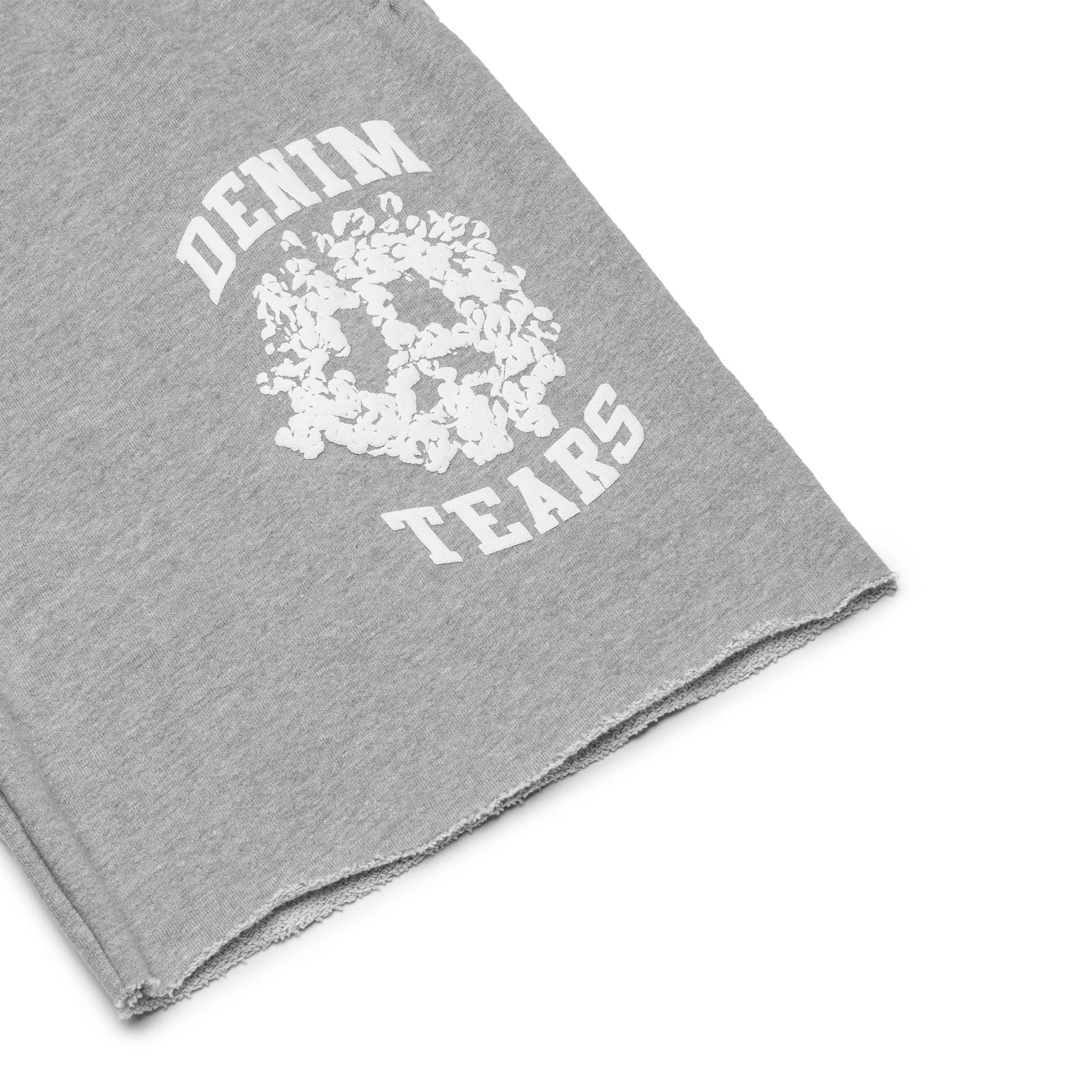 Leg view of Denim Tears University Grey Shorts