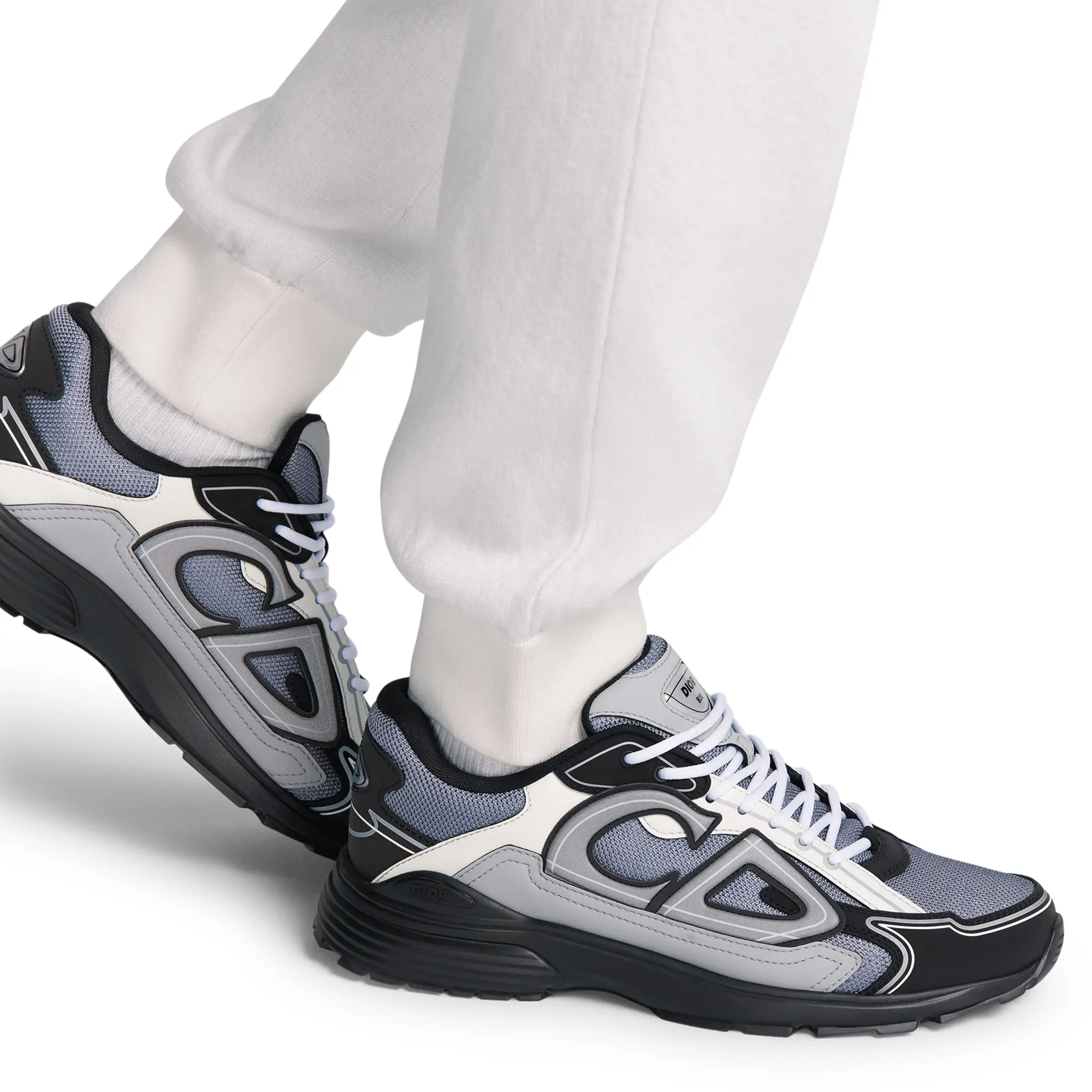 Model side view of Dior B30 Mesh Blue Grey White Black Trainer 3SN279ZRB_H068