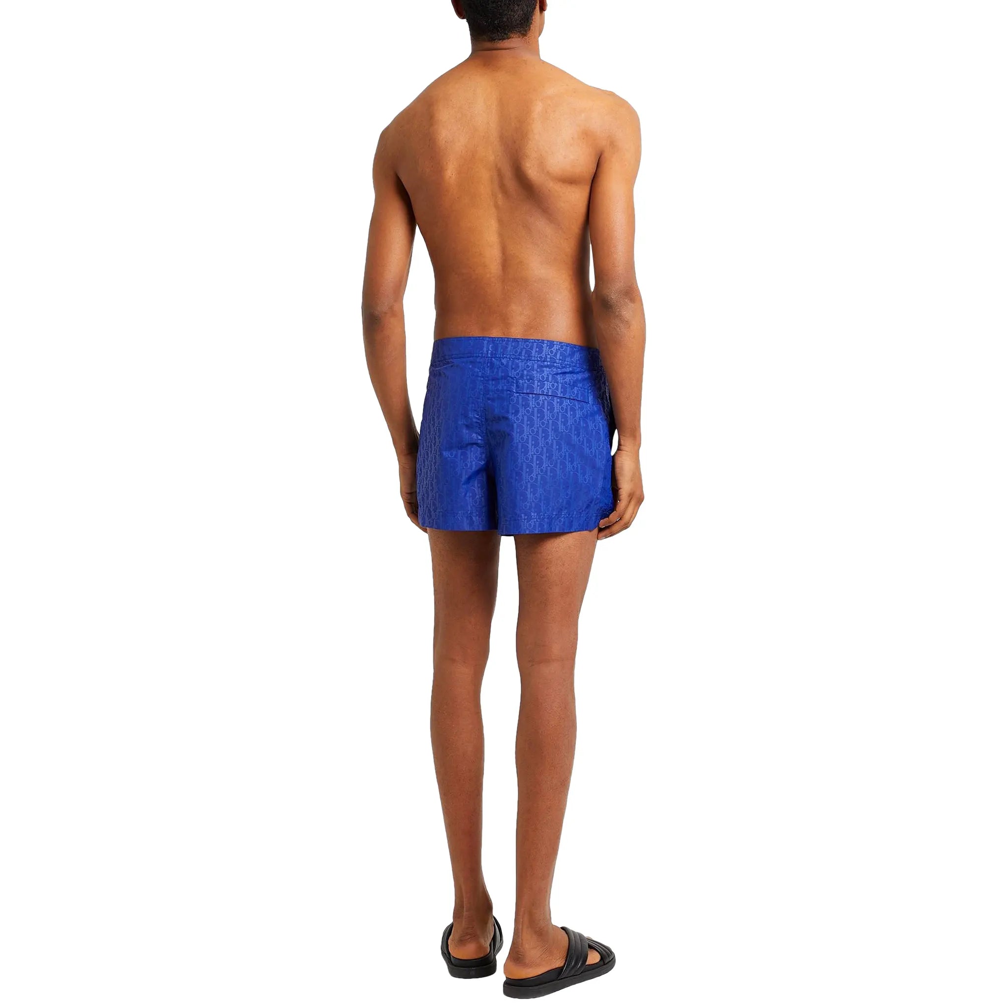 Model back view of Dior Oblique Swim Shorts Blue 193B104AB041_C506