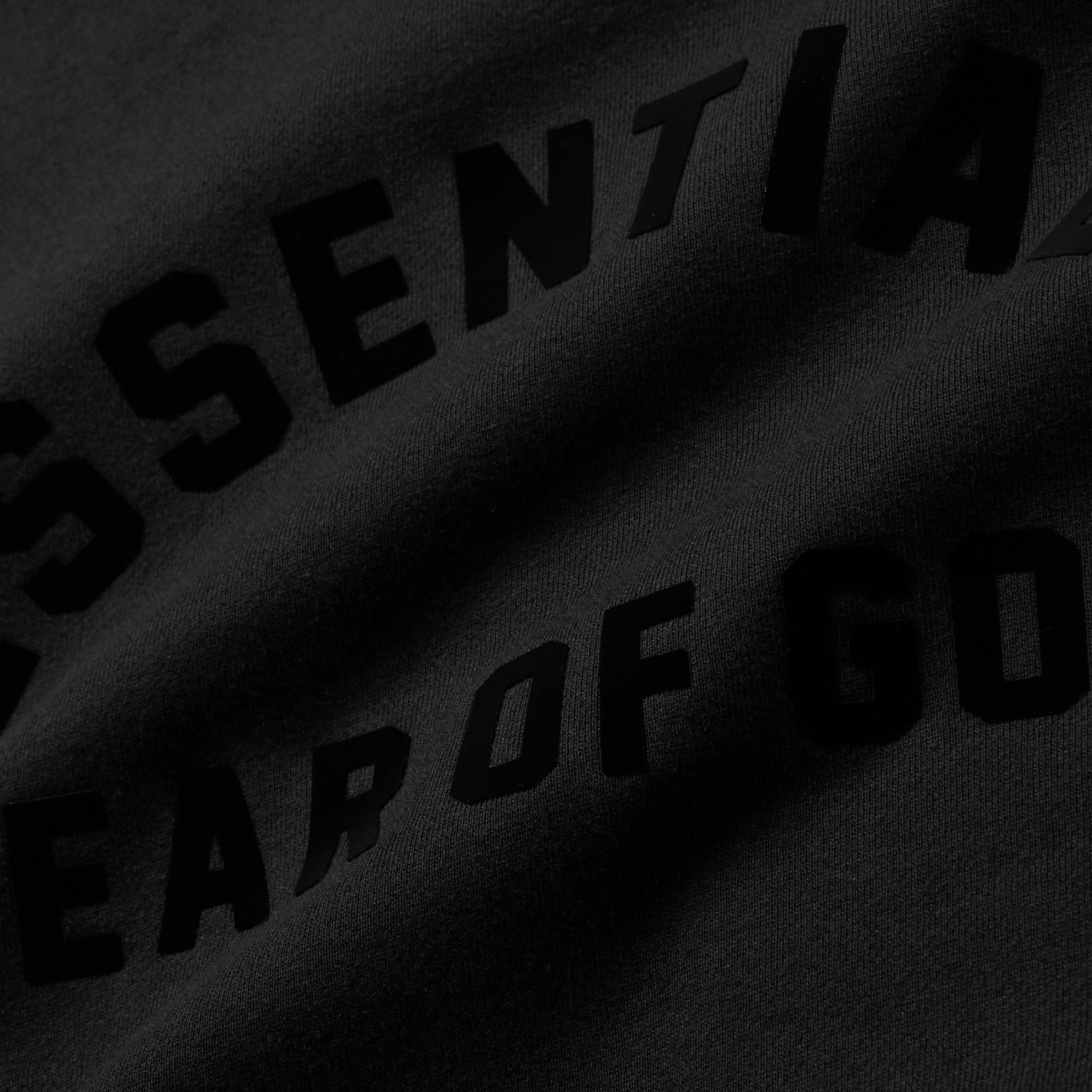 Logo view of Fear Of God Essentials Black Hoodie (SS23)