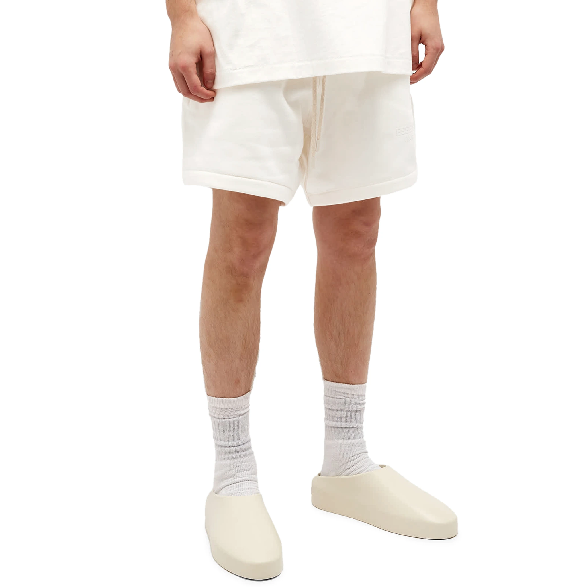 Model front view of Fear Of God Essentials Cloud Dancer Shorts (FW23) 160BT232001F