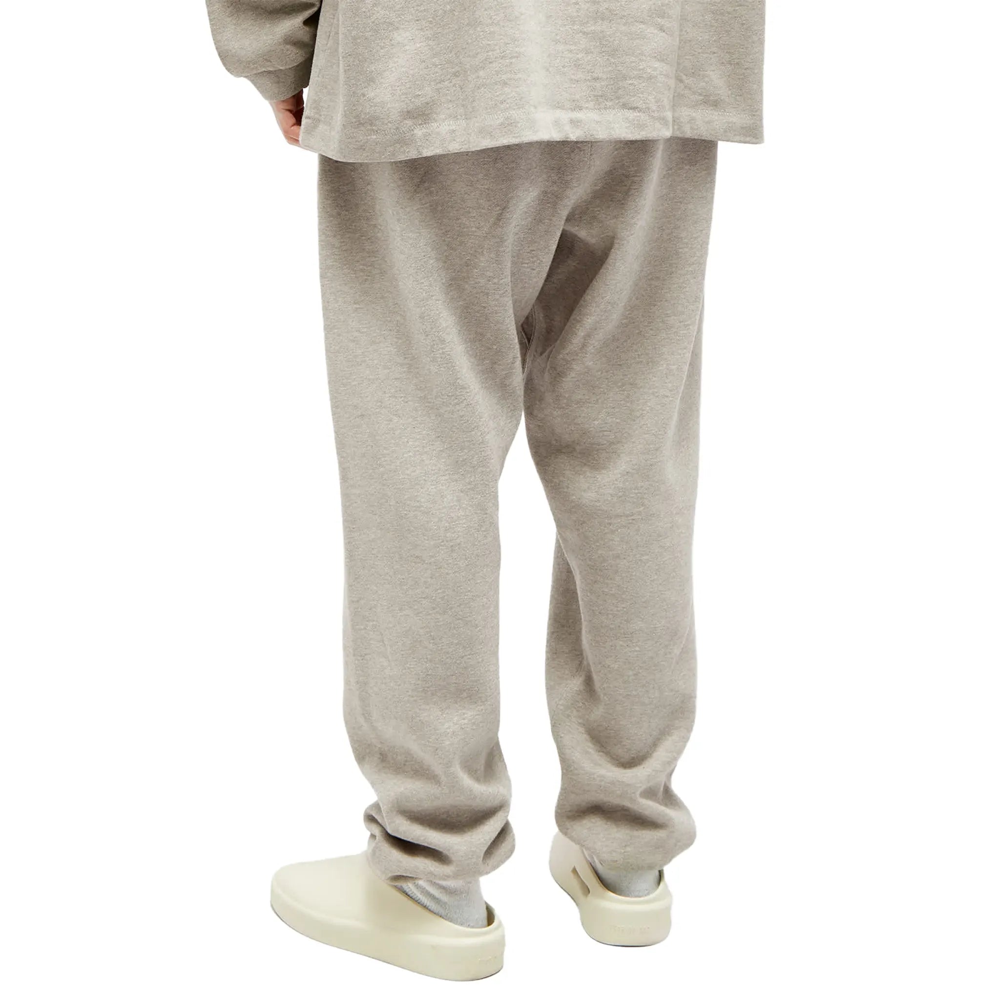 Back Side View of Model Front Side View of Fear Of God Essentials Core Collection Dark Heather Oatmeal Sweatpants (FW23) 130SP242023F