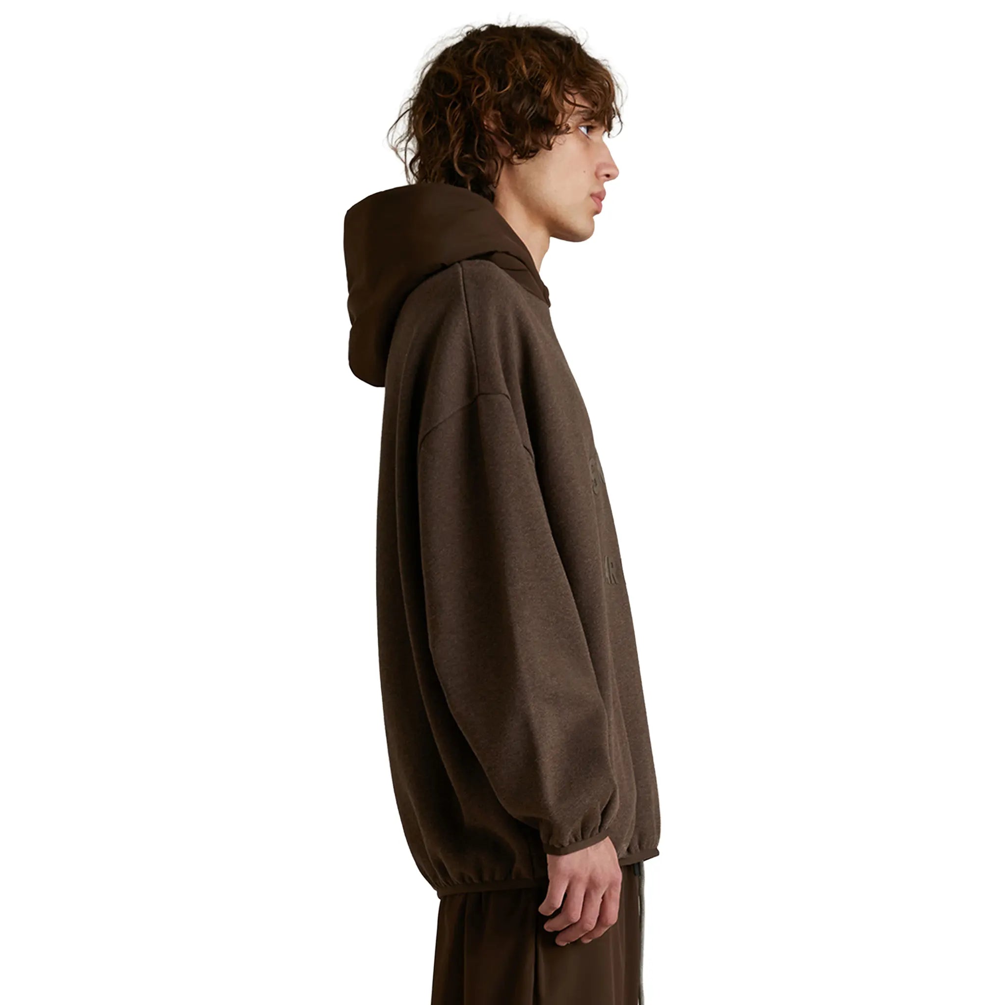 Model Side View of Fear Of God Essentials Core Collection Nylon Fleece Heather Wood Hoodie 192SU242052F