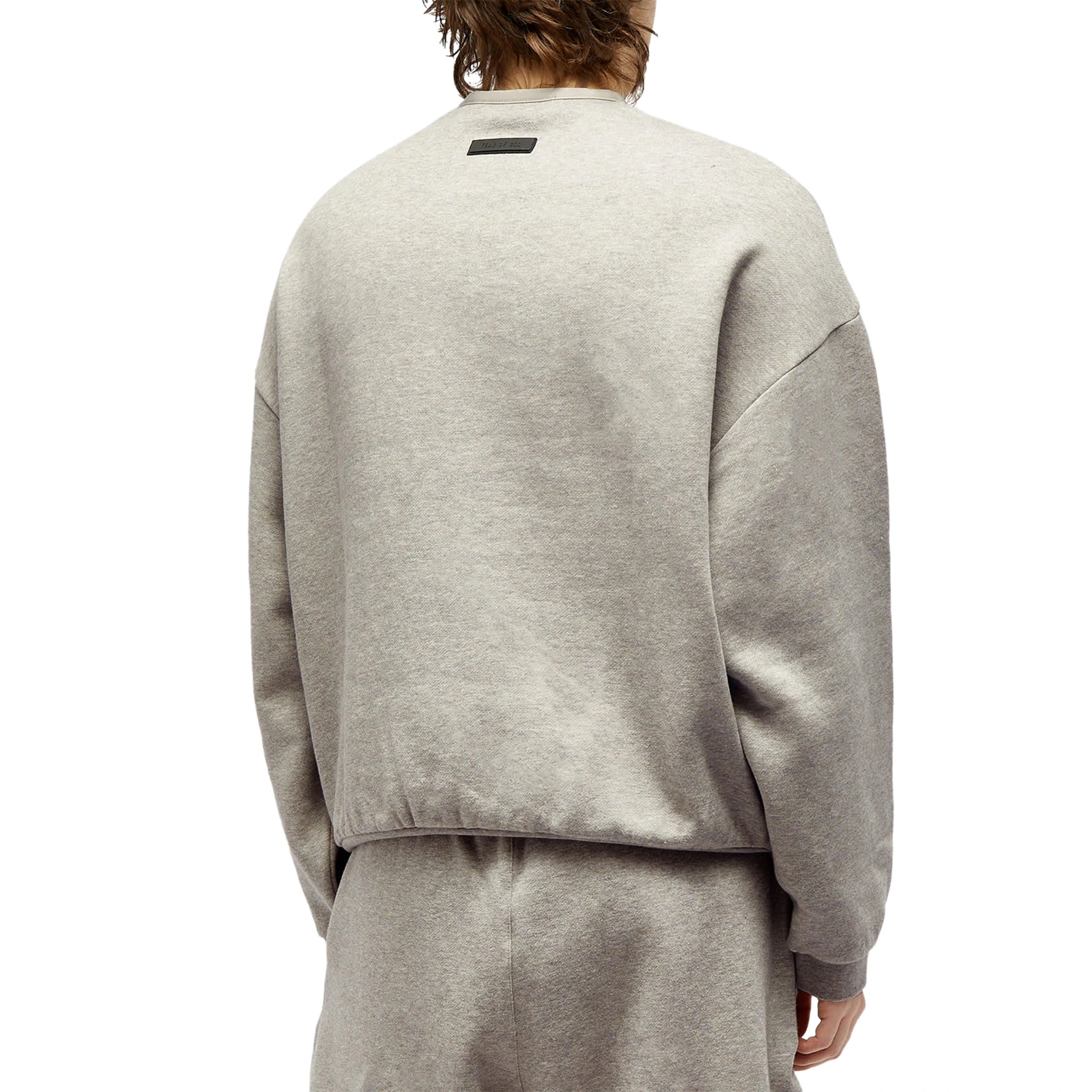 Model back view of Fear Of God Essentials Dark Heather Oatmeal Crewneck (FW23) 192SP244683F