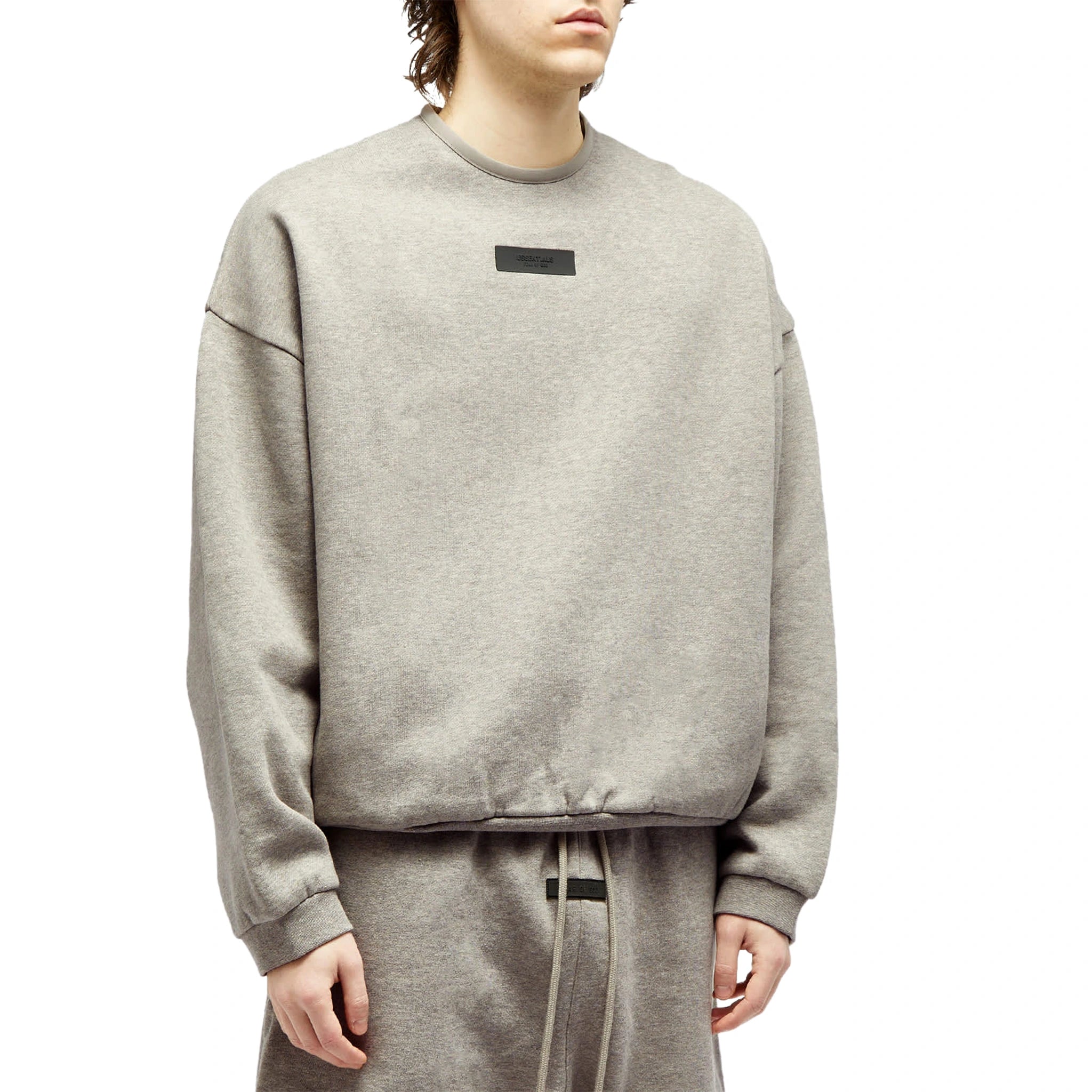 Model front view of Fear Of God Essentials Dark Heather Oatmeal Crewneck (FW23) 192SP244683F