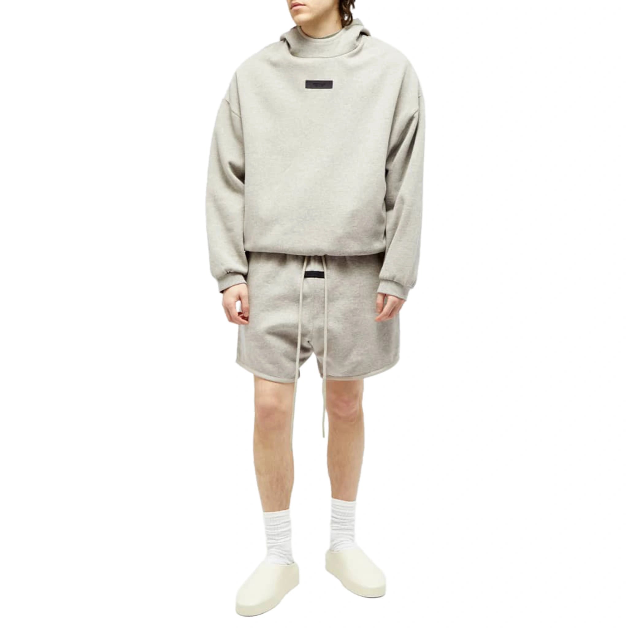 Model view of Fear Of God Essentials Dark Heather Oatmeal Shorts (FW23) 160SP242003F