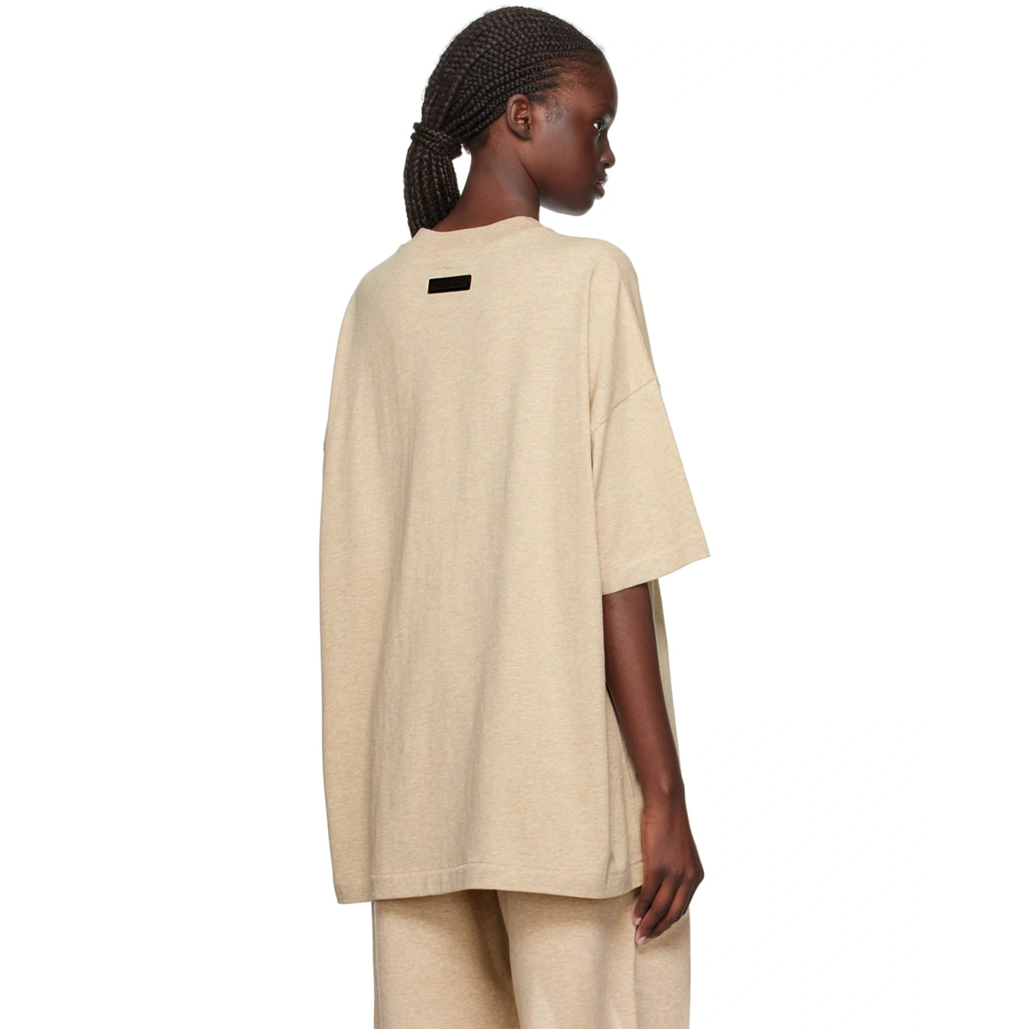 Model back view of Fear Of God Essentials Gold Heather T Shirt (FW23) 125BT232003F