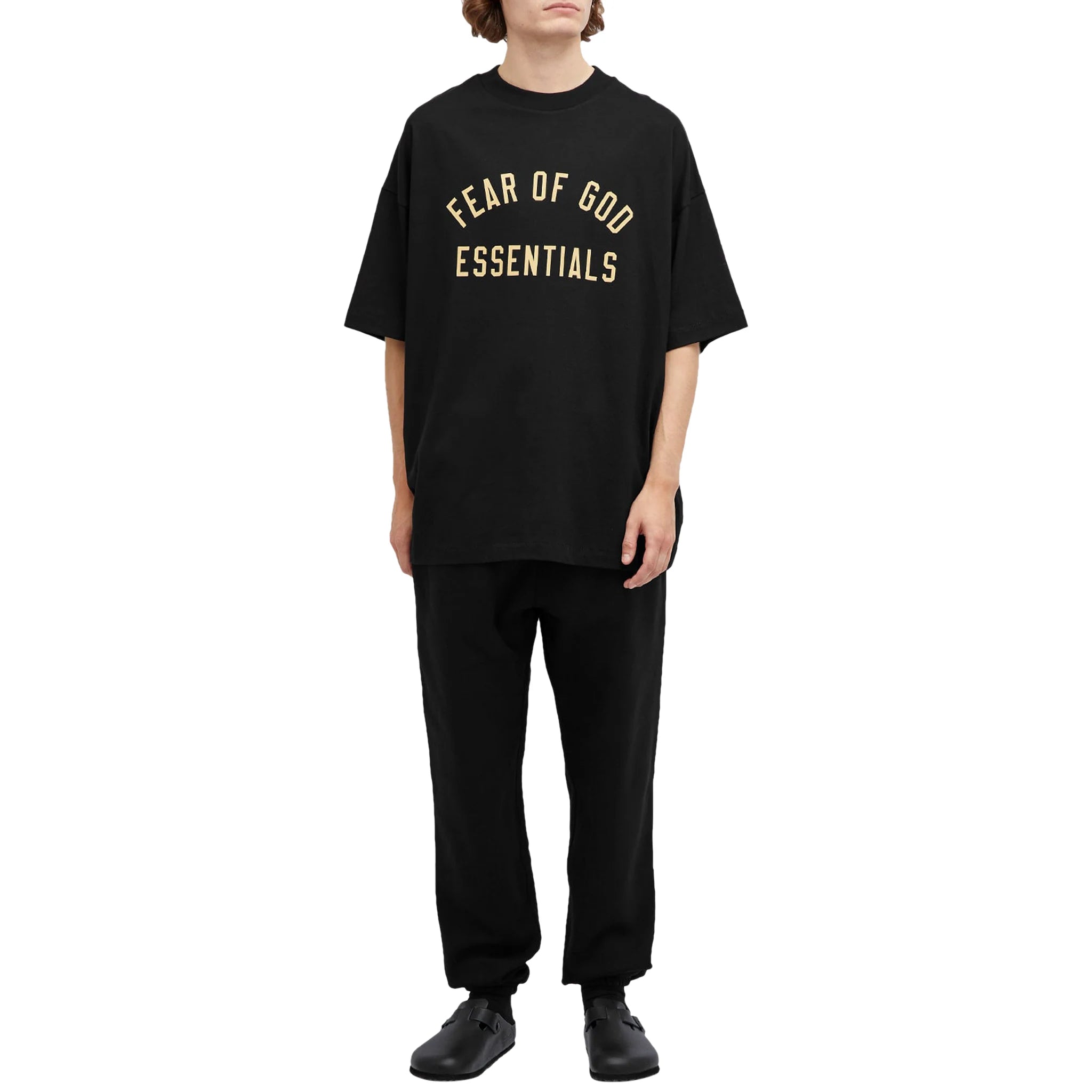 Model full view of Fear Of God Essentials Jersey Crewneck Black T Shirt (FW24)