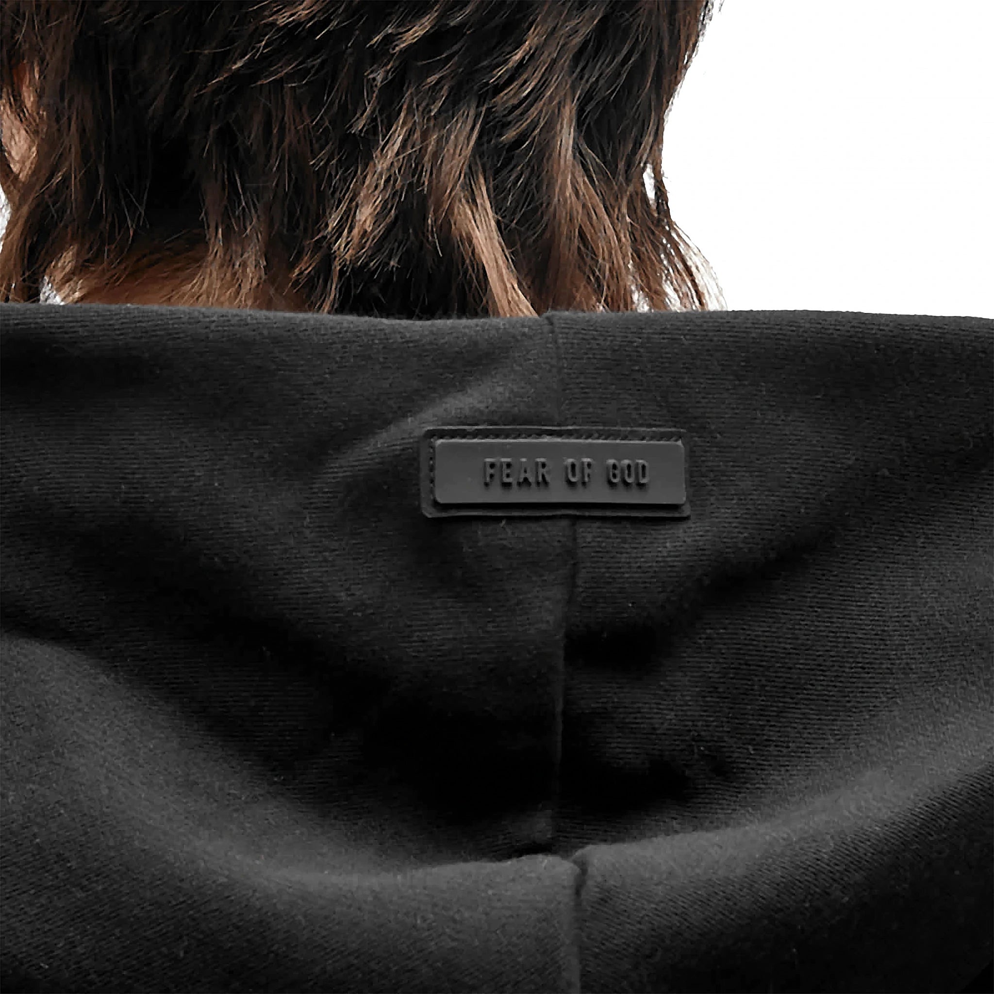 Hood view of Fear Of God Essentials Jet Black Hoodie (FW23)