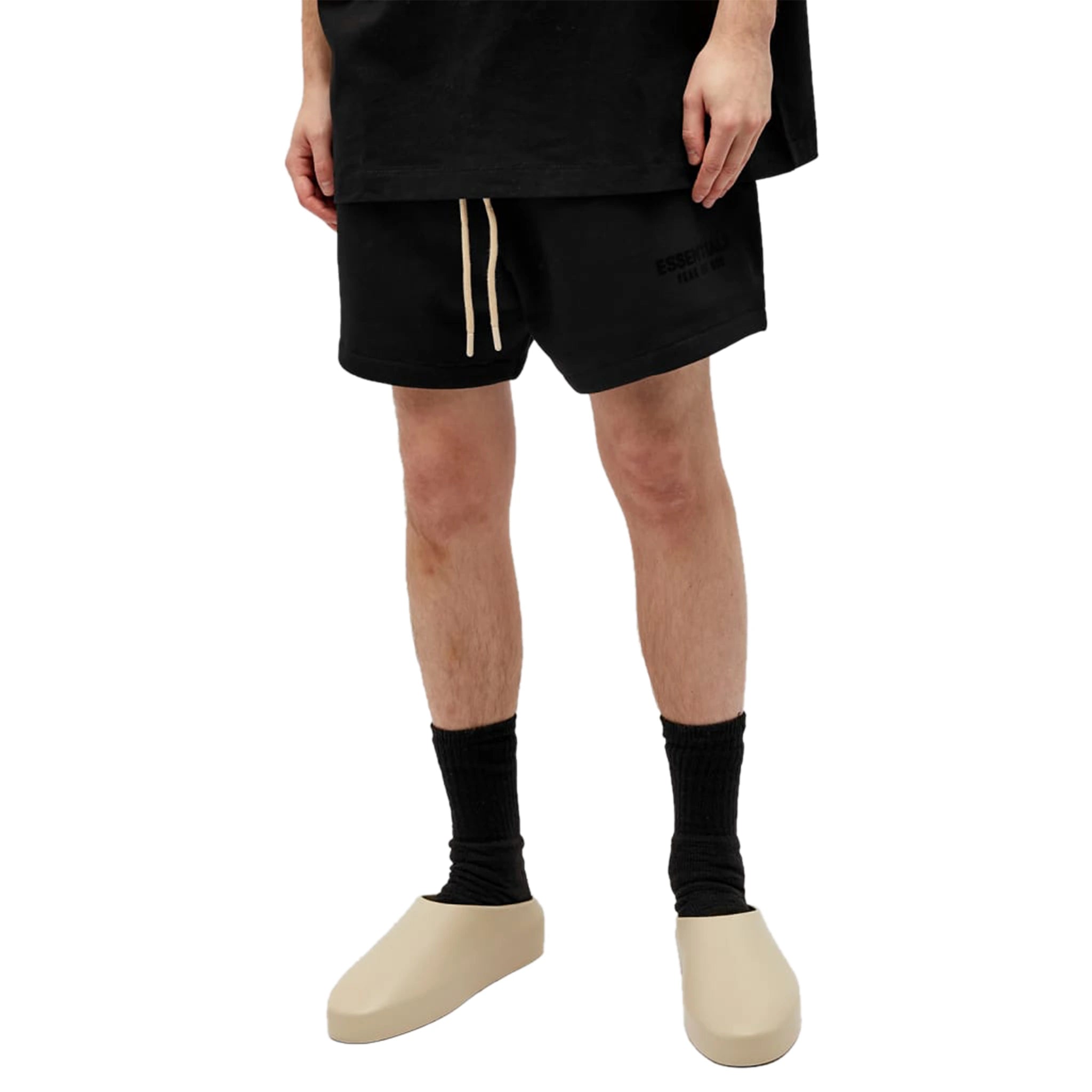 Model Front view of Fear Of God Essentials Jet Black Shorts (FW23) 160BT232000F